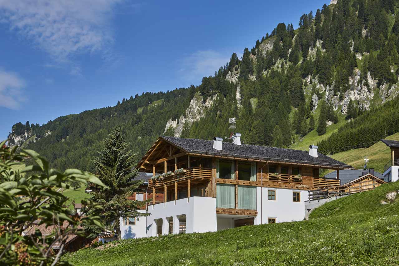 Summer exterior view of Casa Feroze in Alta Badia
