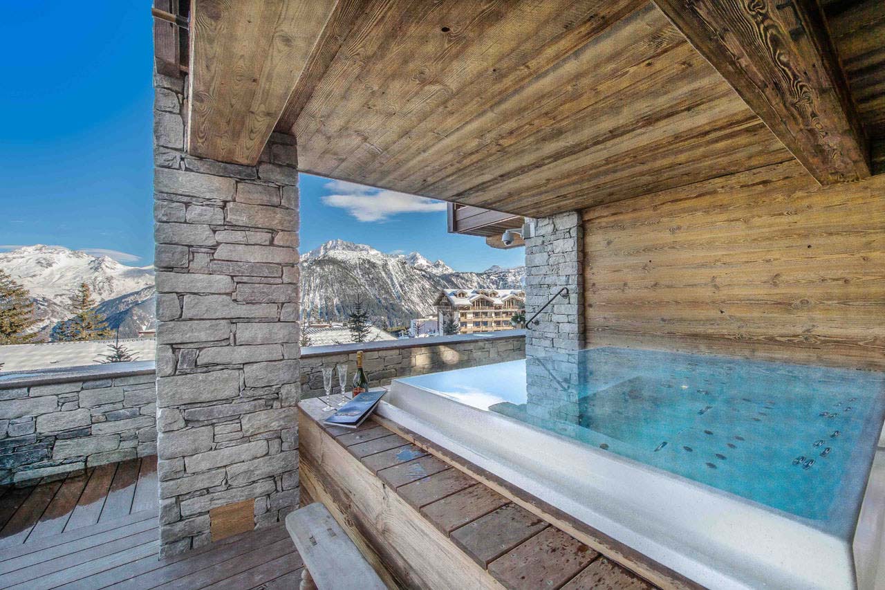 Terrace with an outdoor Jacuzzi in Chalet Cryst'Aile in Courchevel 1850