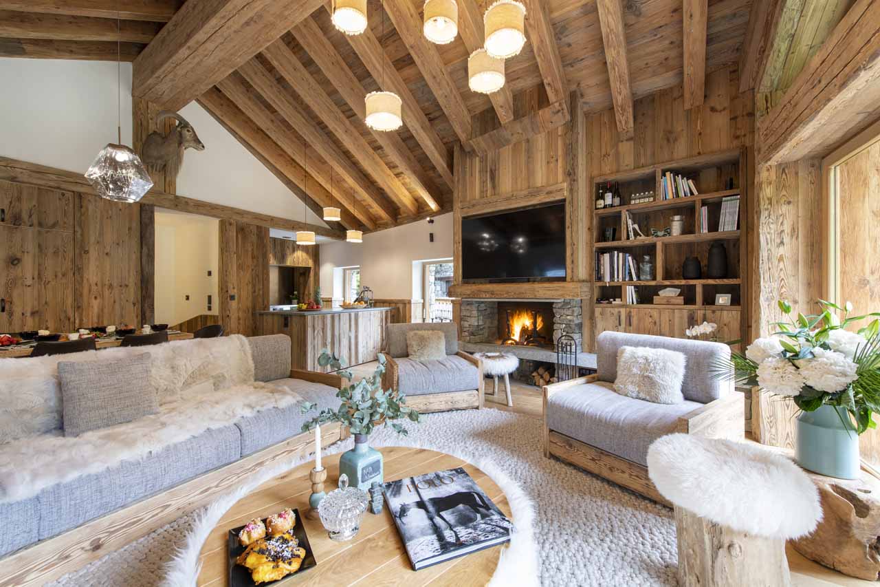 Fireplace in living room at Chalet Oxalis in Val d'Isere