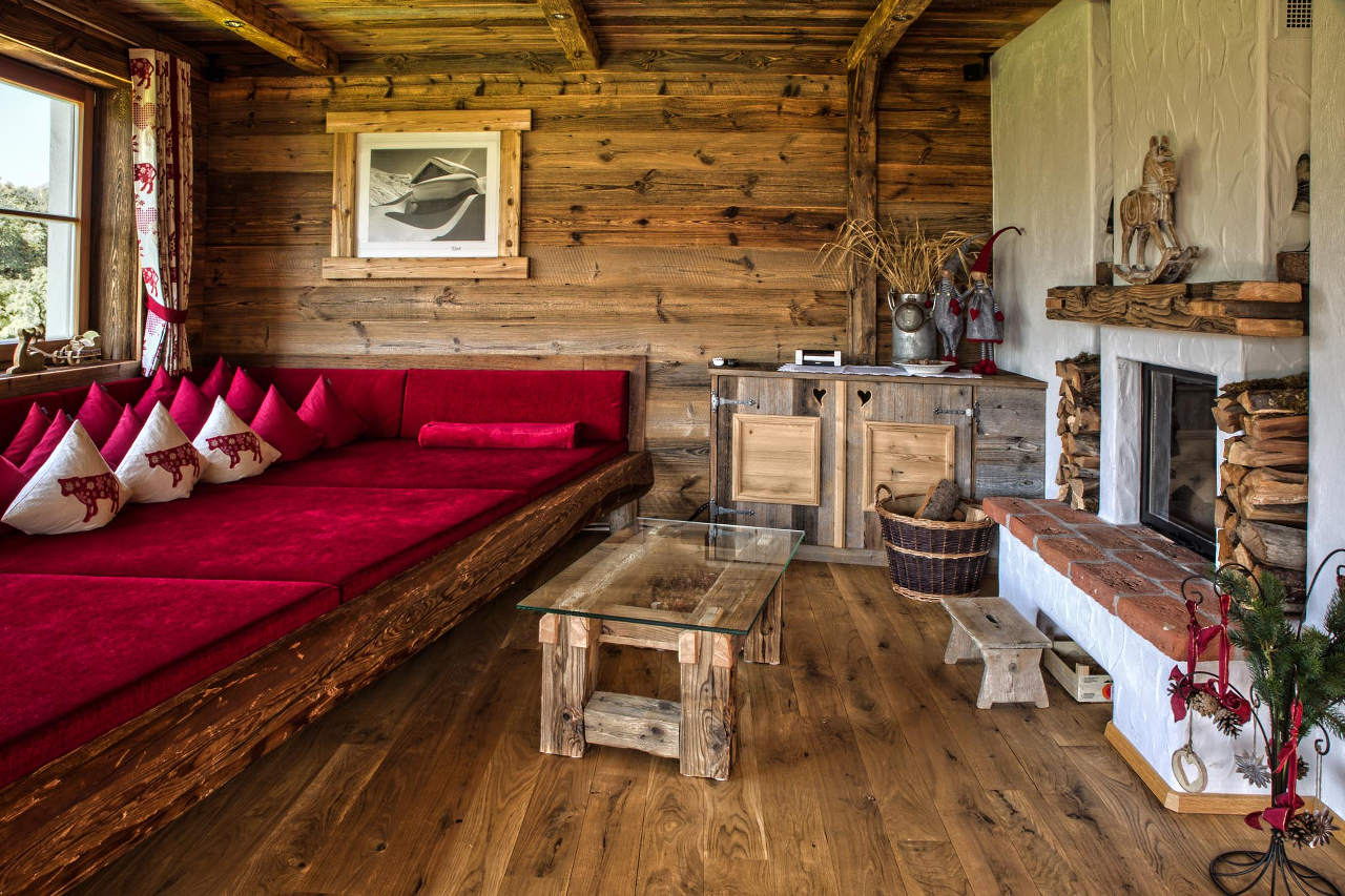 Lounge with fireplace and balcony access of Chalet Ziller in Zillertal