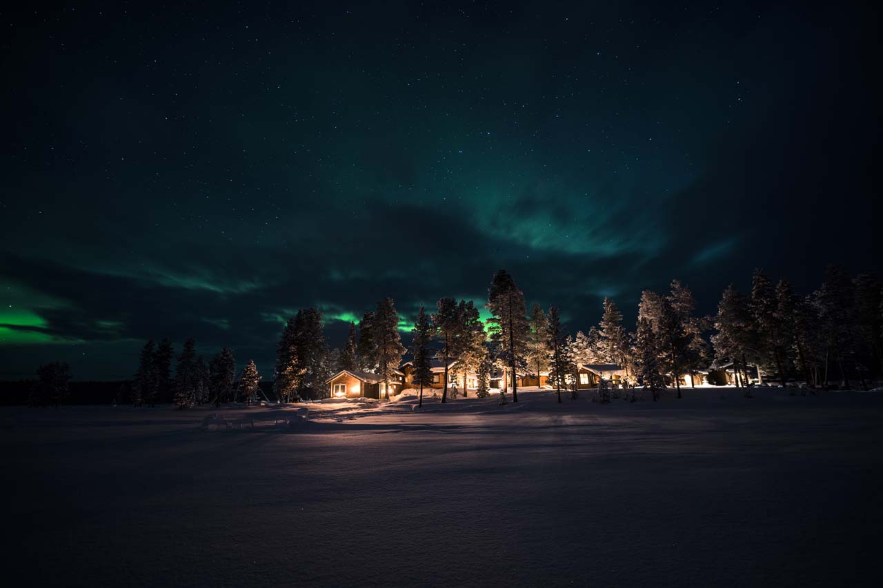 Northern lights over Fjellborg Arctic Lodge in Sweden