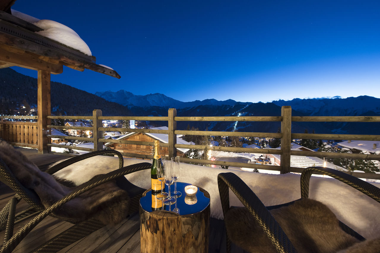 Furnished balcony of Le Daray Penthouse in Verbier at night