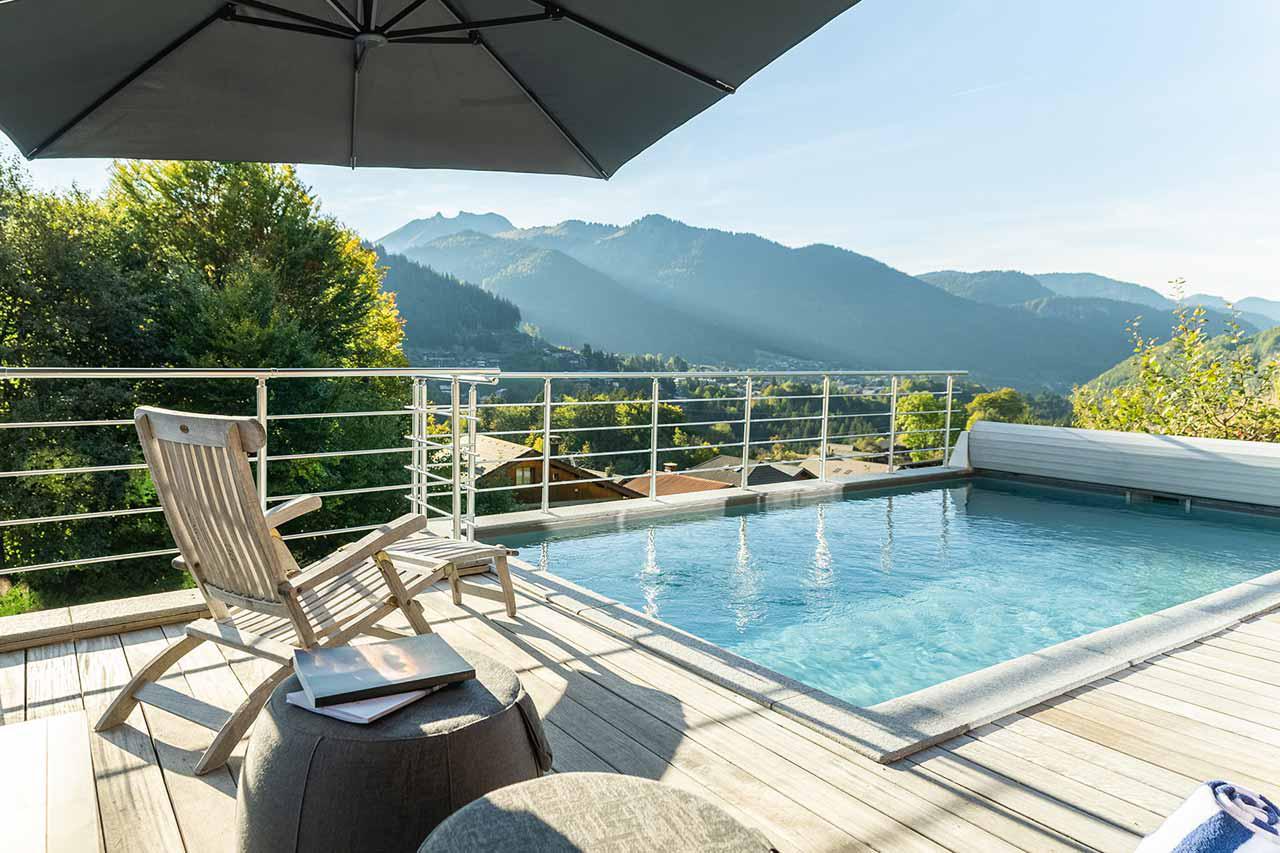 Outdoor pool at Alpine Retreat in Morzine in summer