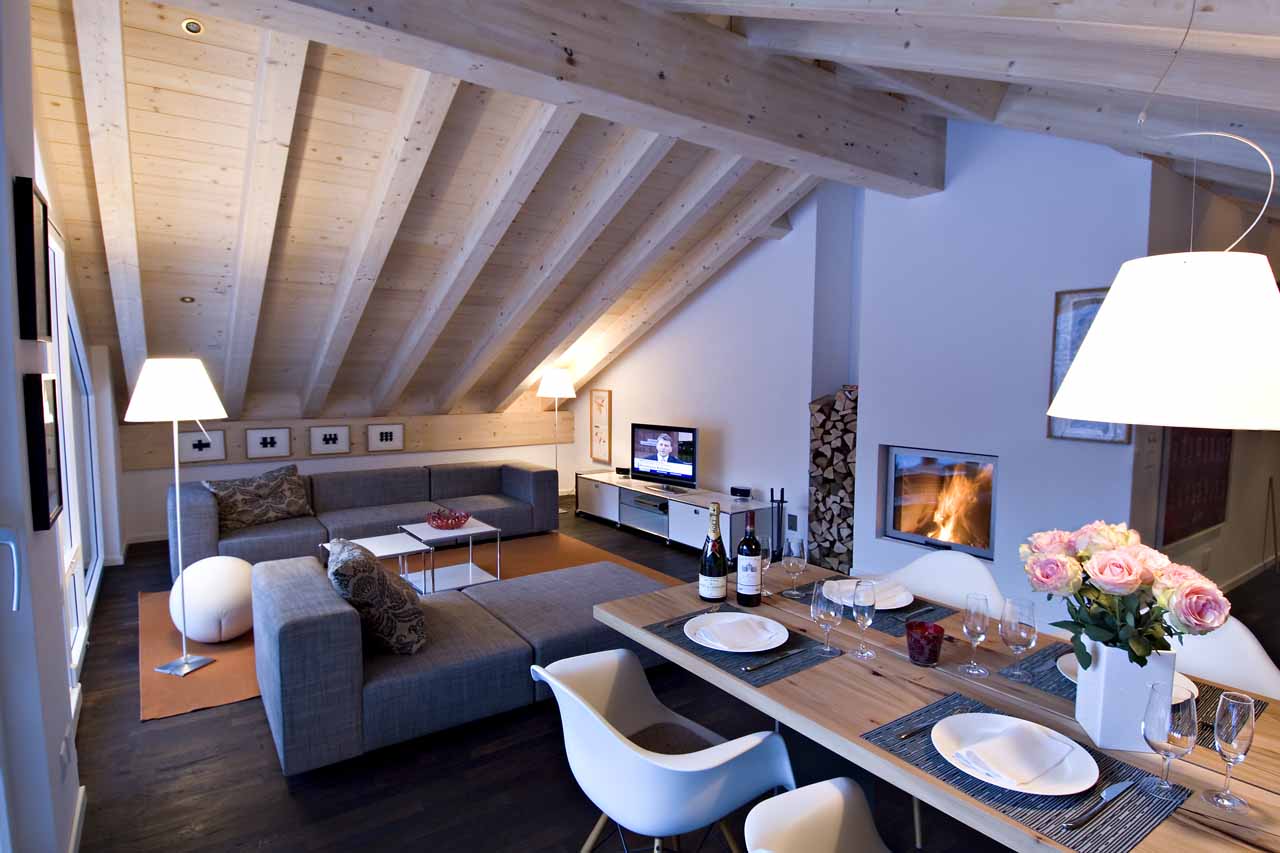Fireplace in living area at Penthouse Altesse in Zermatt