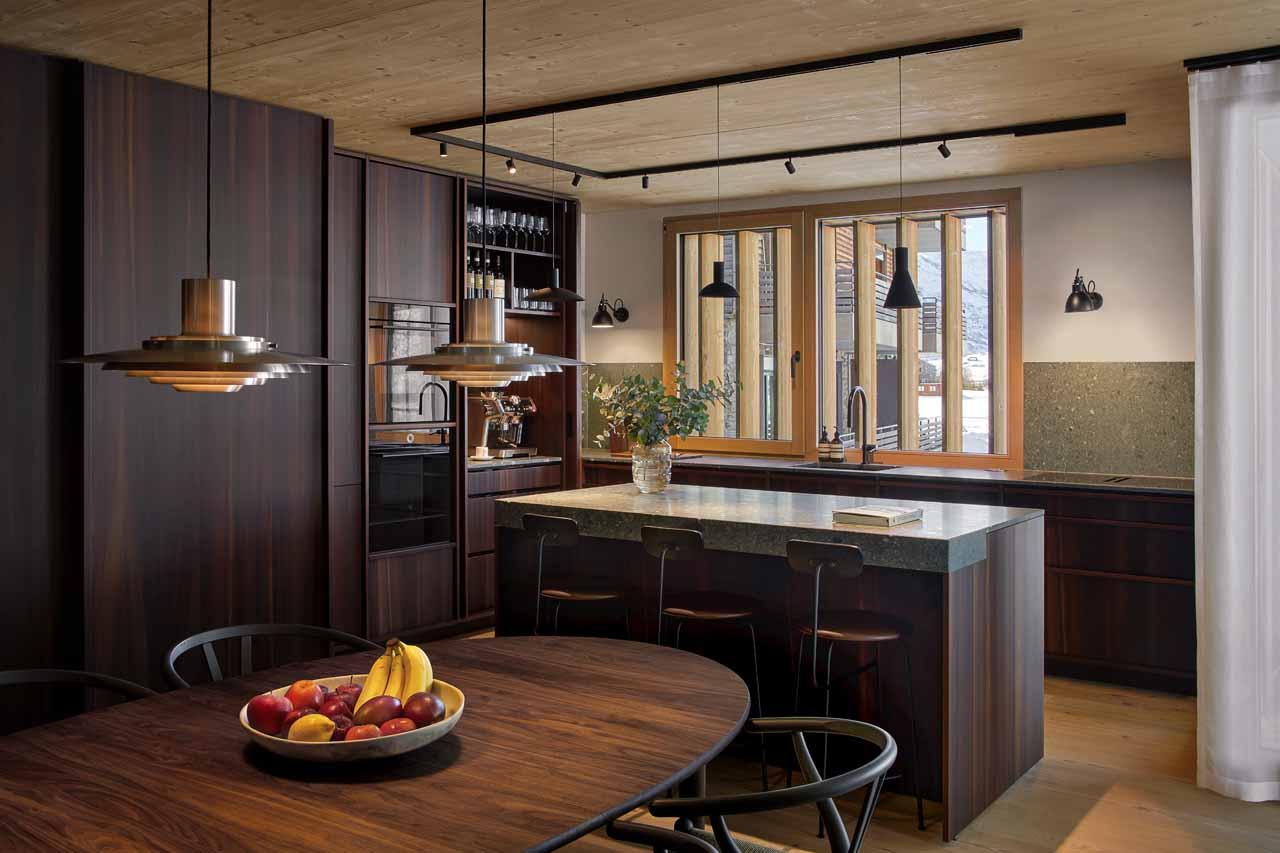 Kitchen with island and dining table in Andermatt Alpine Premium 1, Andermatt