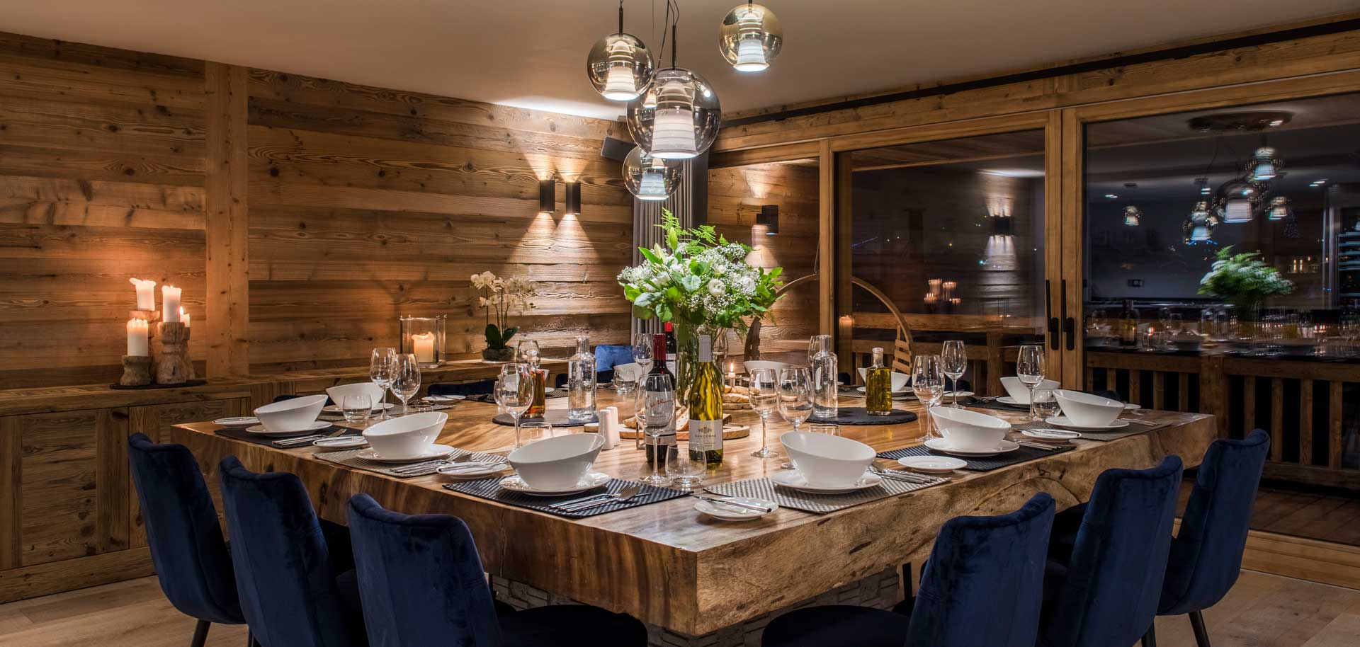 Catered chalet Sapphire in Morzine dining table in the evening