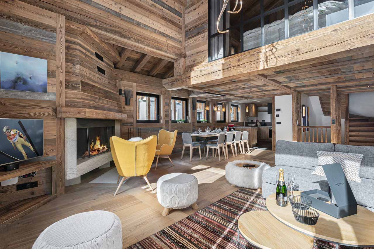 Fireplace and dining area at Chalet Angelus 1 in Val d'Isere