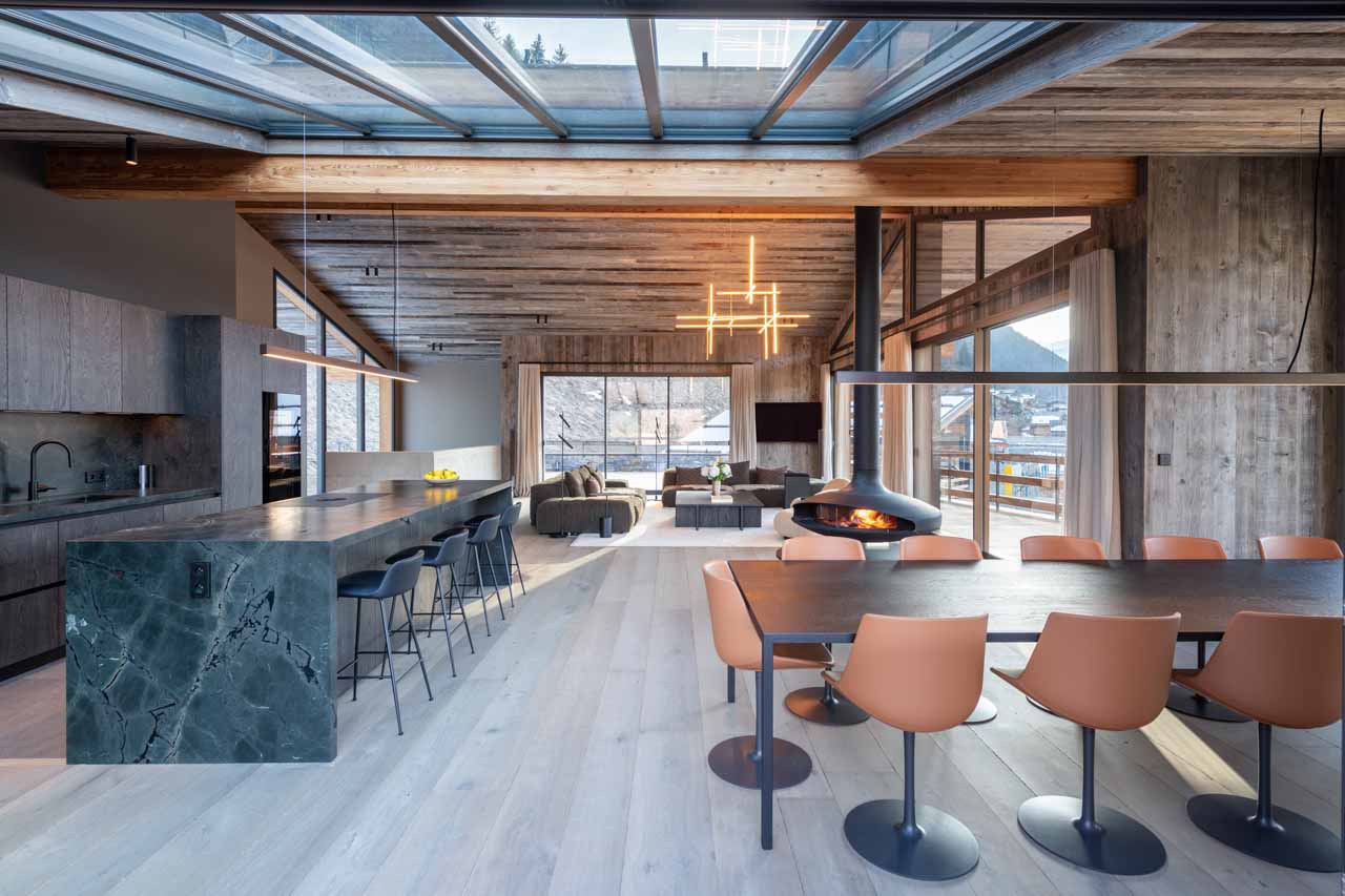 Dining table and kitchen at Chalet Bisou in Morzine