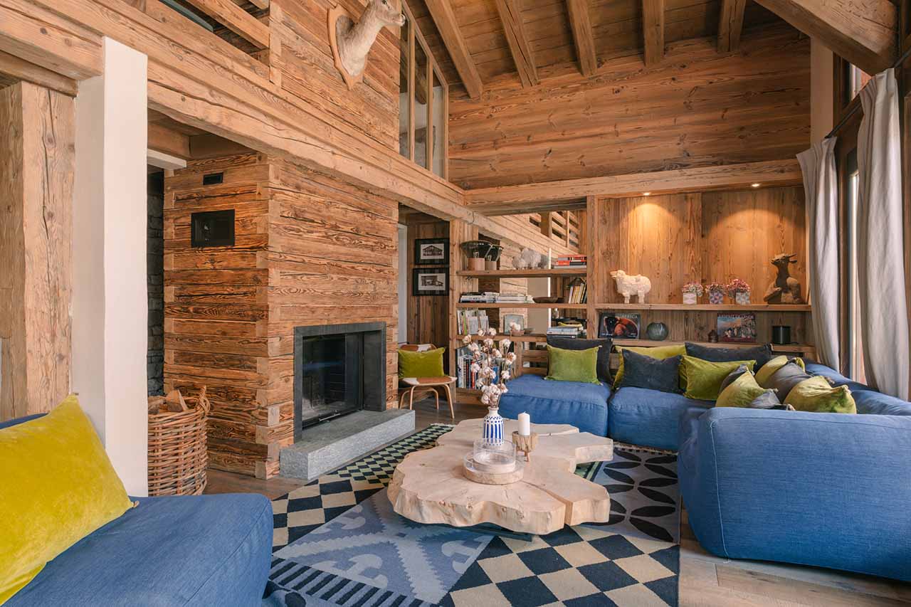Cosy living area with fireplace at Chalet Calistoga in Val d'Isere