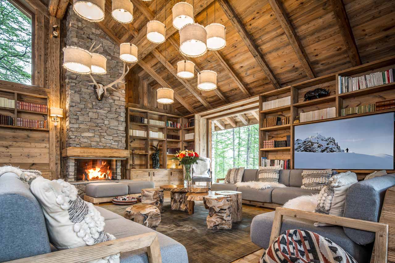 Fireplace in living area at Chalet Inoko in Val d'Isere