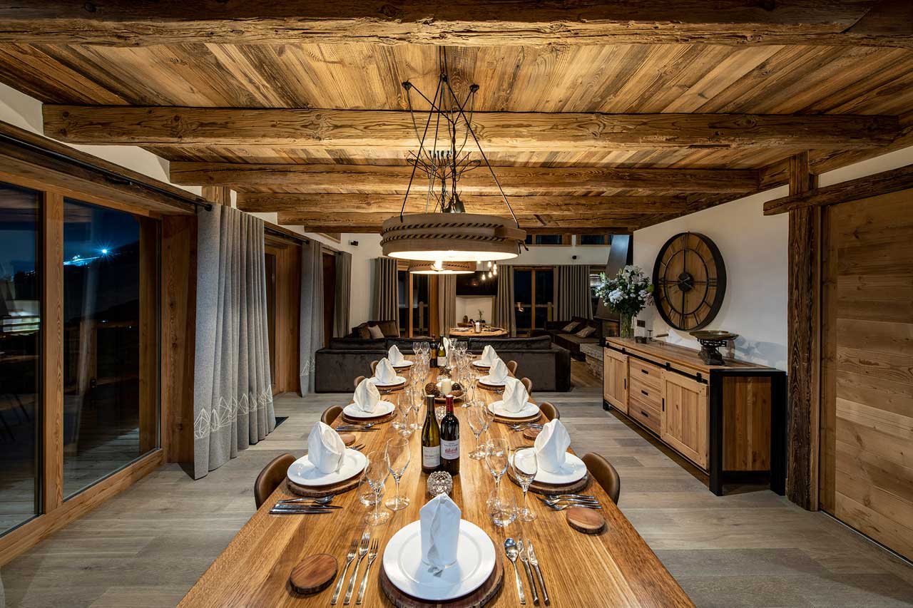 Dining area at night at Chalet Machapuchare in Val d'Isere