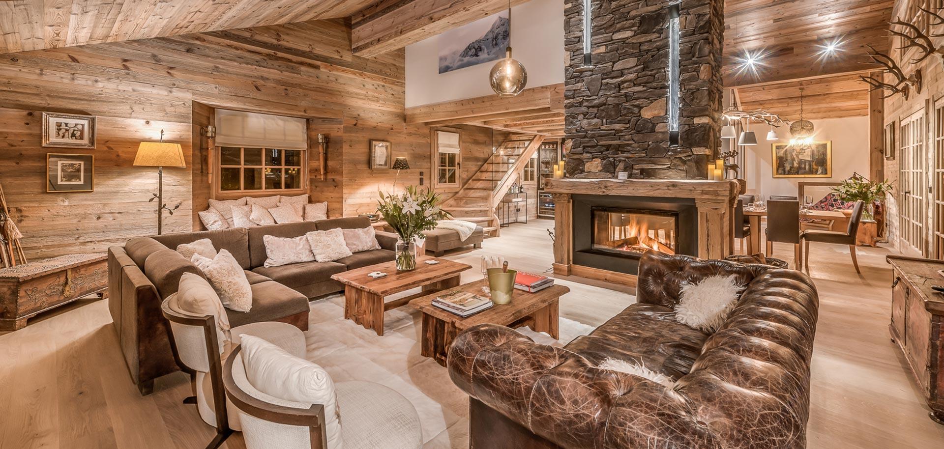 Living room with fireplace at Chalet Le Namaste in Courchevel
