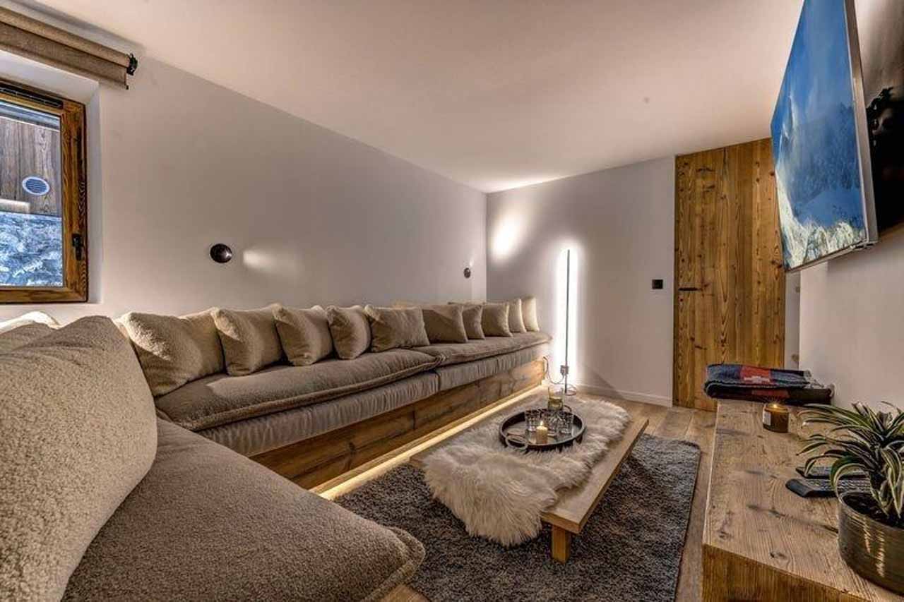 Cinema room with large corner sofa in Chalet Zanskar, St Martin de Belleville