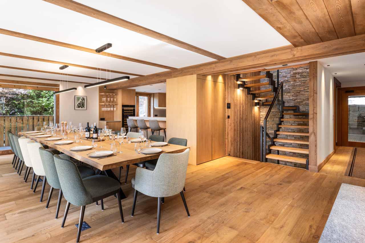 Large wooden dining table at Granite Mountain Lodge in Chamonix