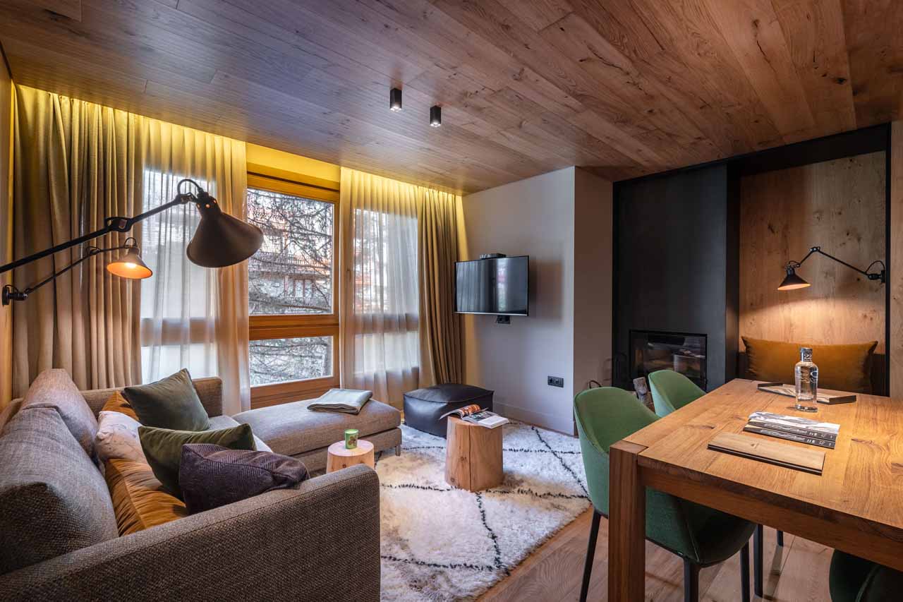 Fireplace and flat screen TV in living area of Hermitage Mountain Residence 120 in Soldeu