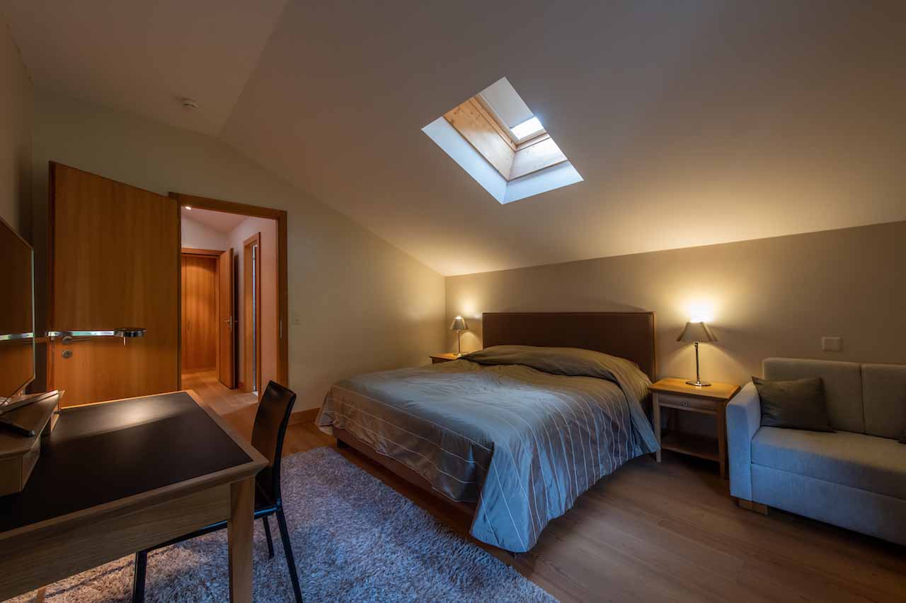 Bedroom two at Royalp Modern Penthouse in Villars