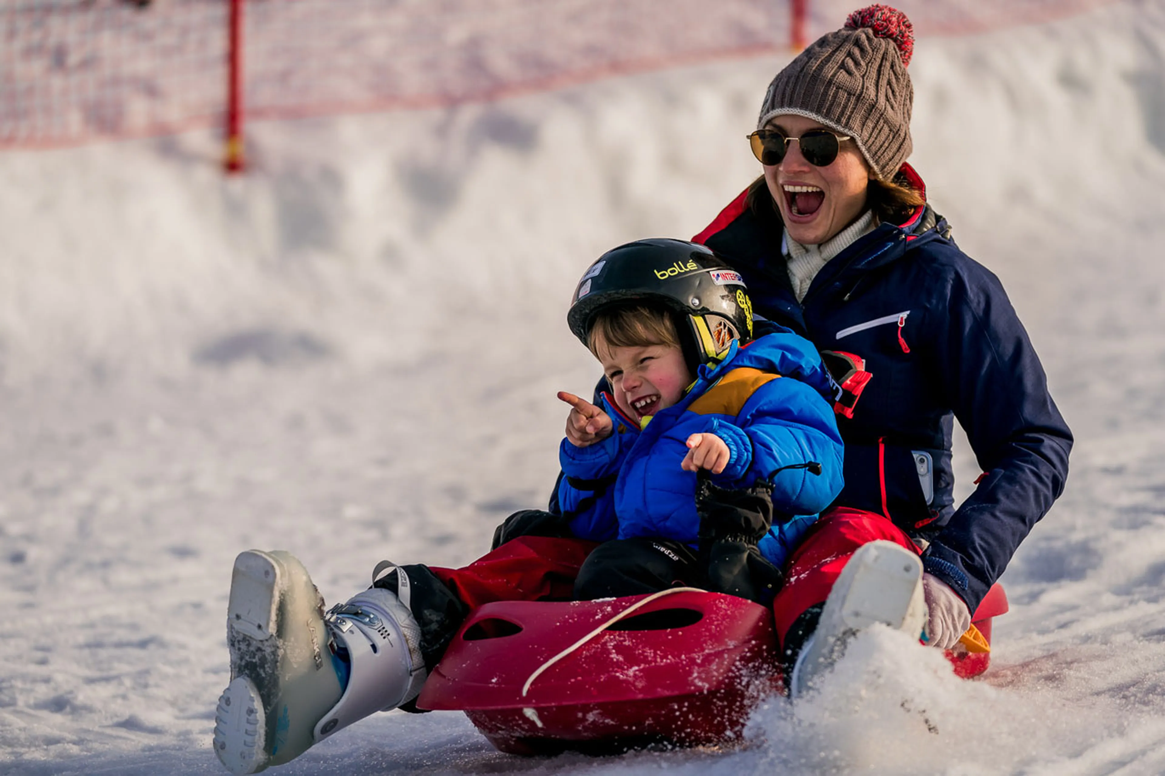 Parent and child sledging in Les Gets