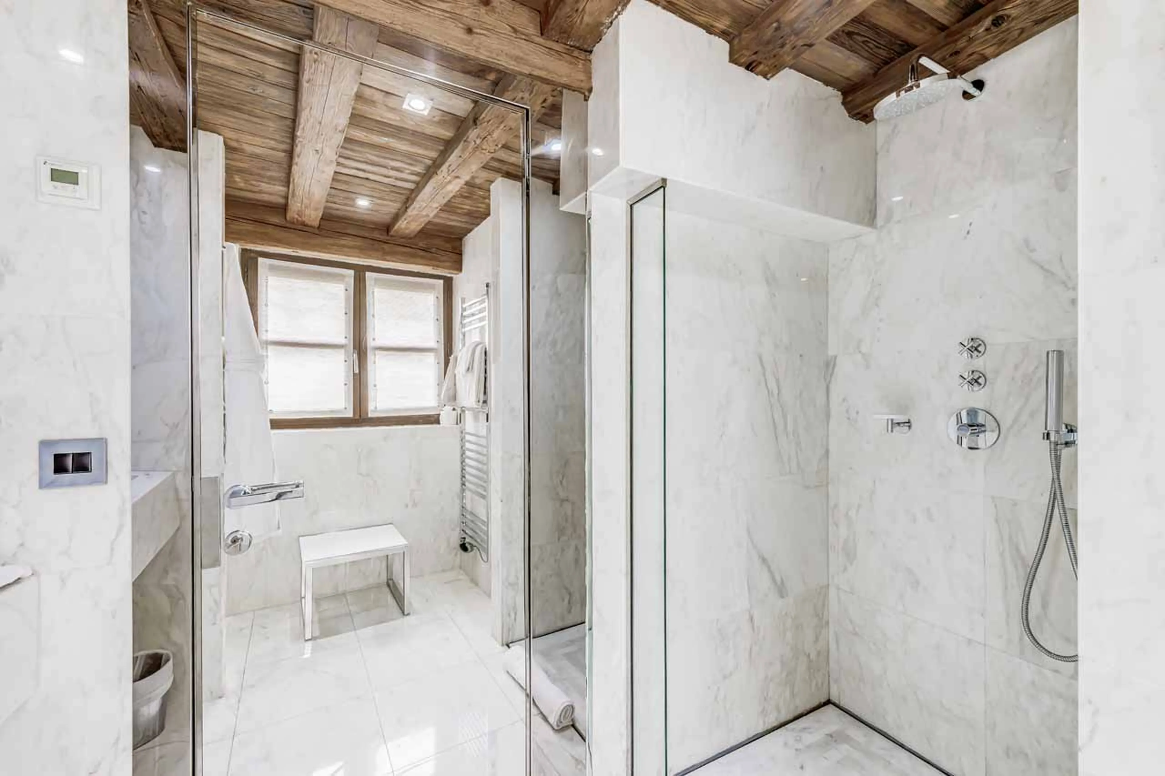En suite double bedroom with terrace access in Chalet Carat in Courchevel 1850