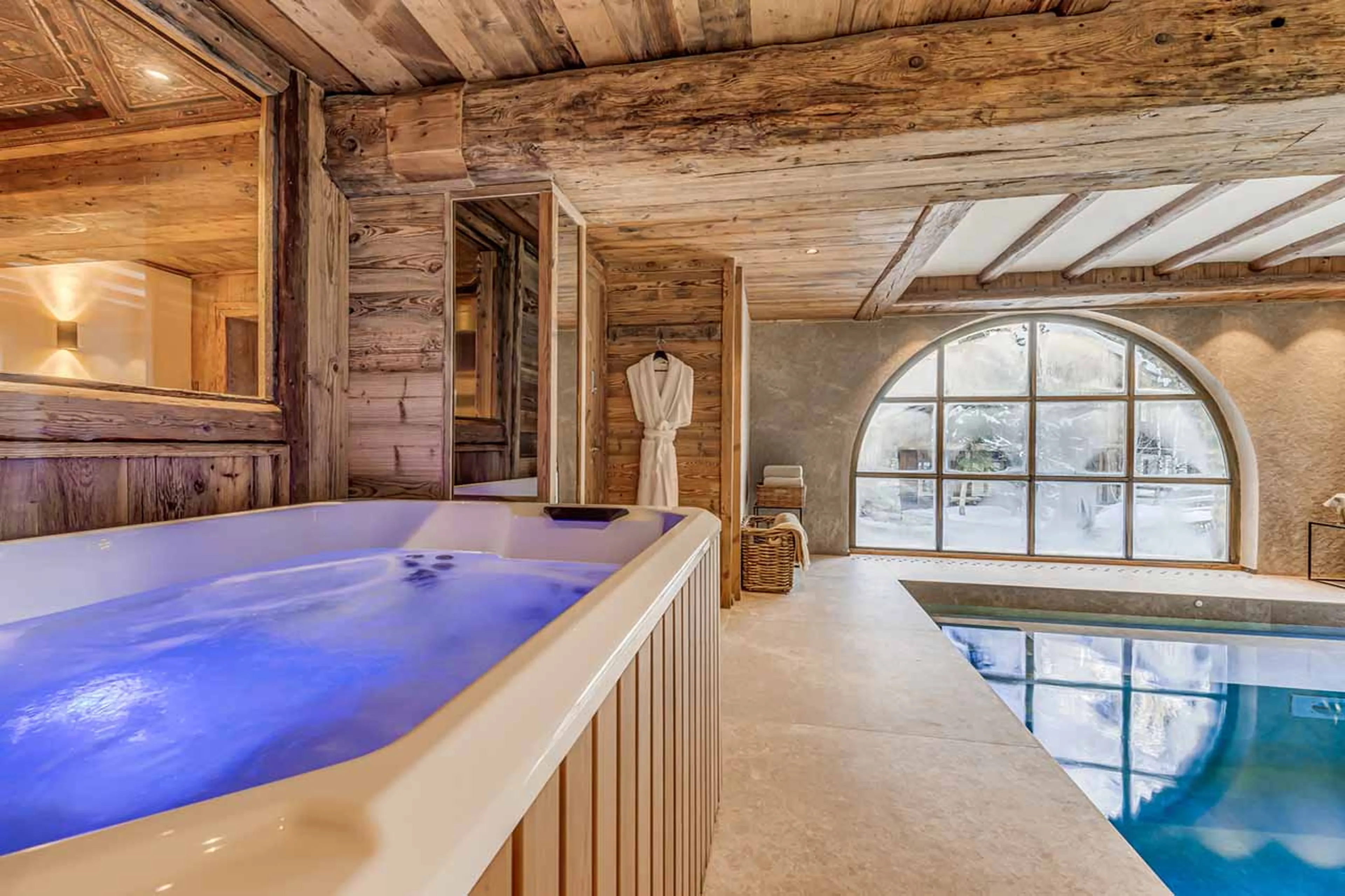 Swimming pool and spa area at Le Rocher, Hameau Alpin in Val d'Isere
