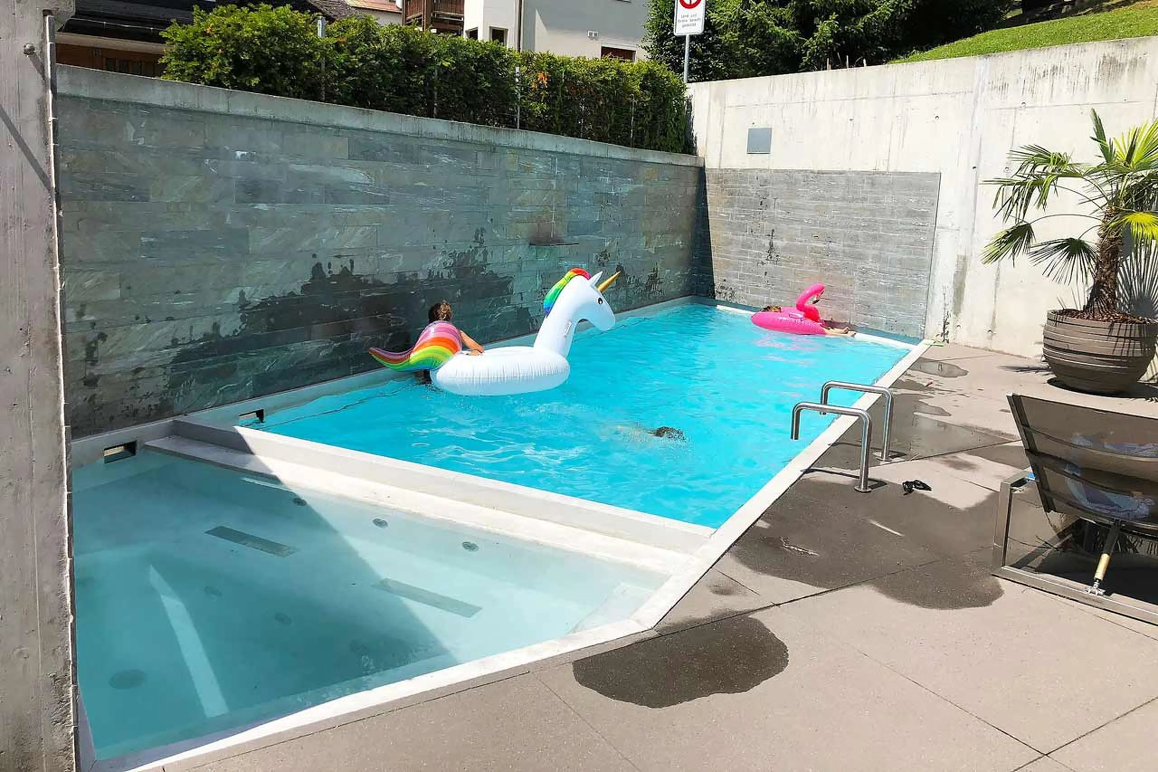 Outdoor pool and Jacuzzi at Chalet Cassons in Flims
