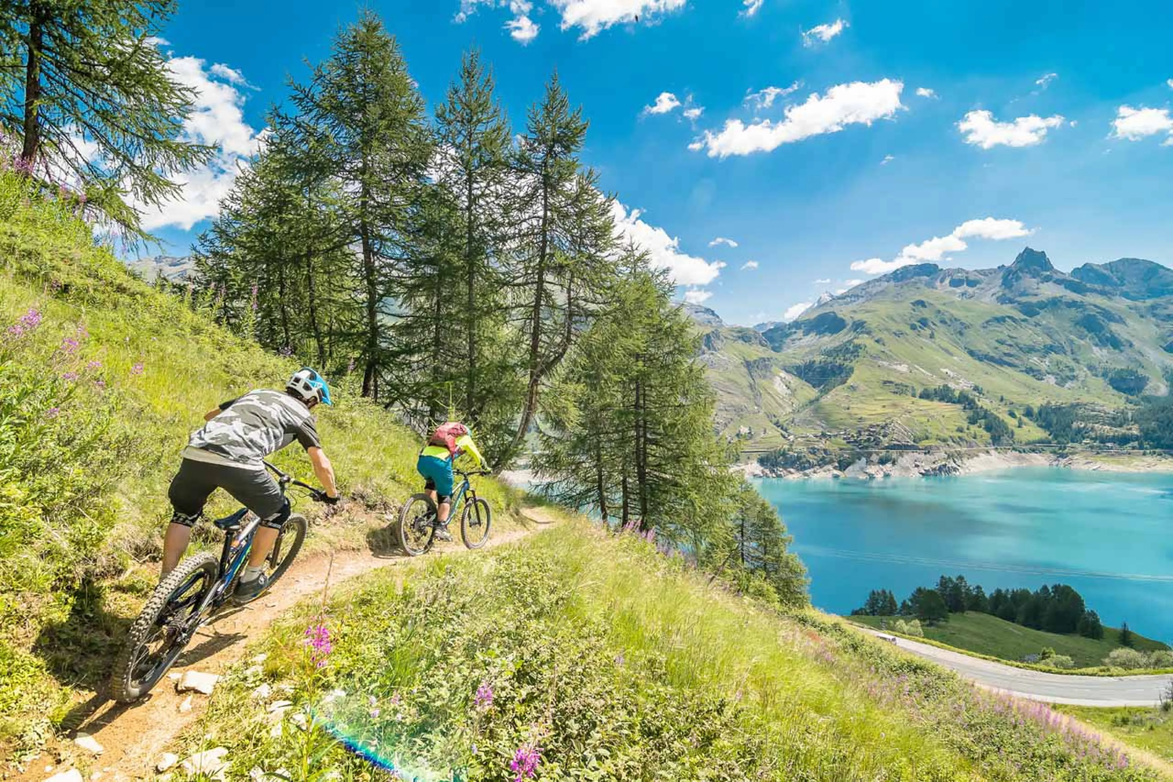 Mountain biking by lake in Tignes