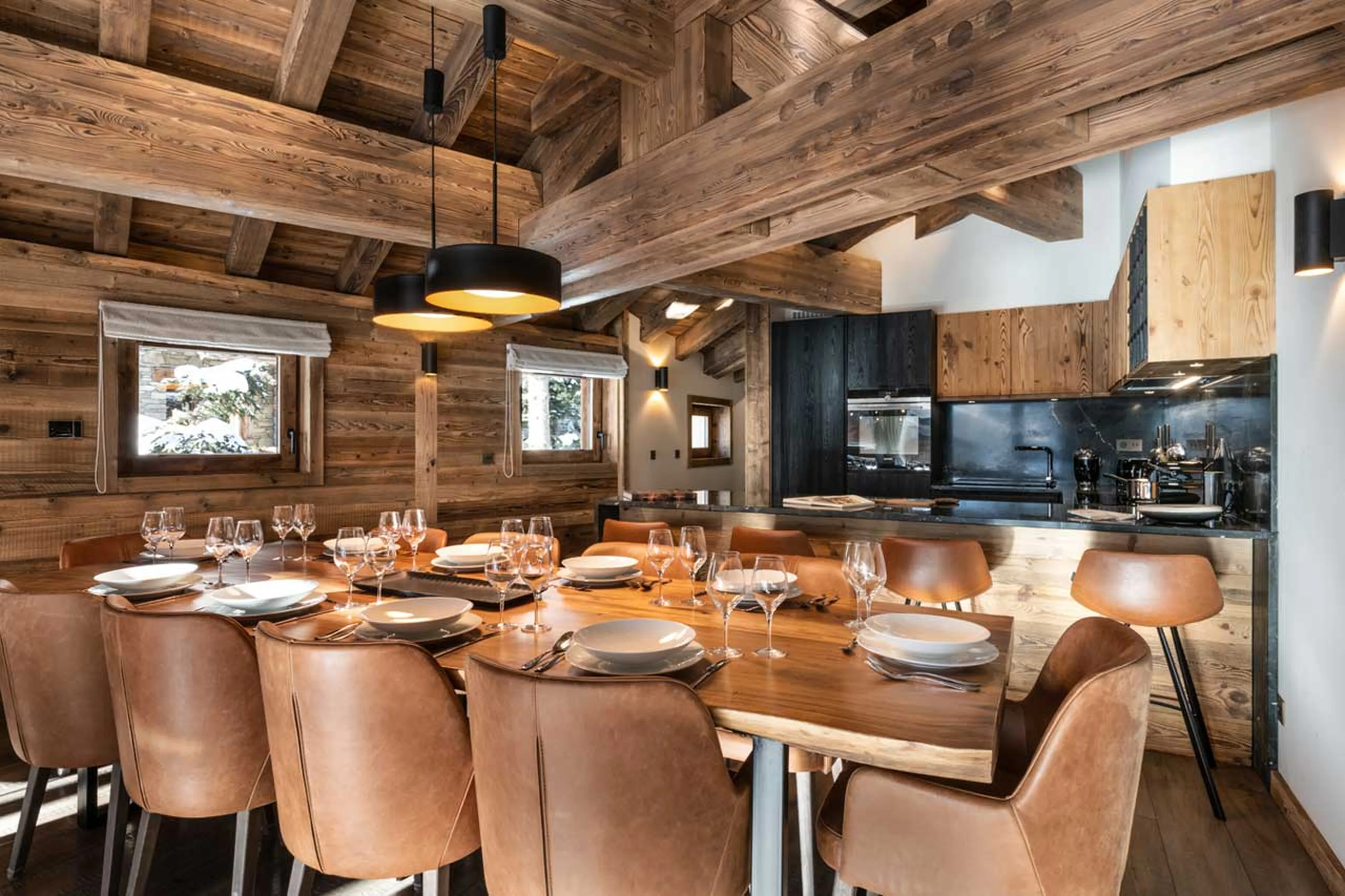 Dining area and kitchen with breakfast bar at Alaska Lodge 6 in Val d'Isere