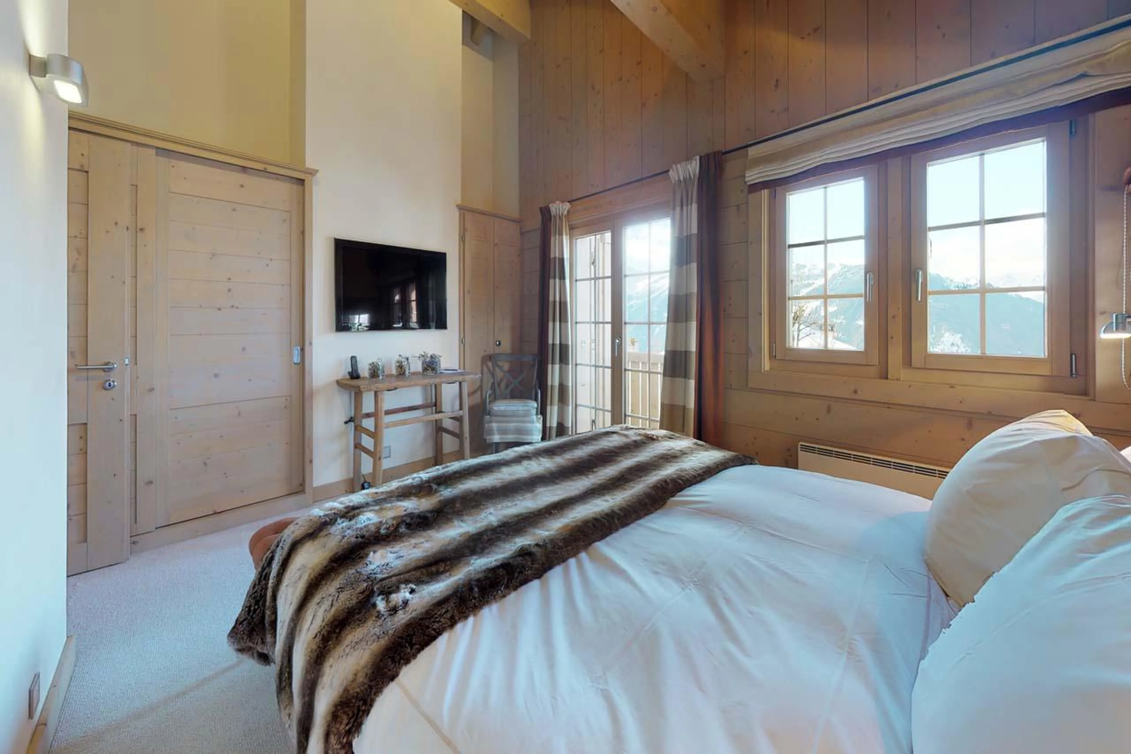 TV and balcony access at Chalet Albert-Luc in Verbier