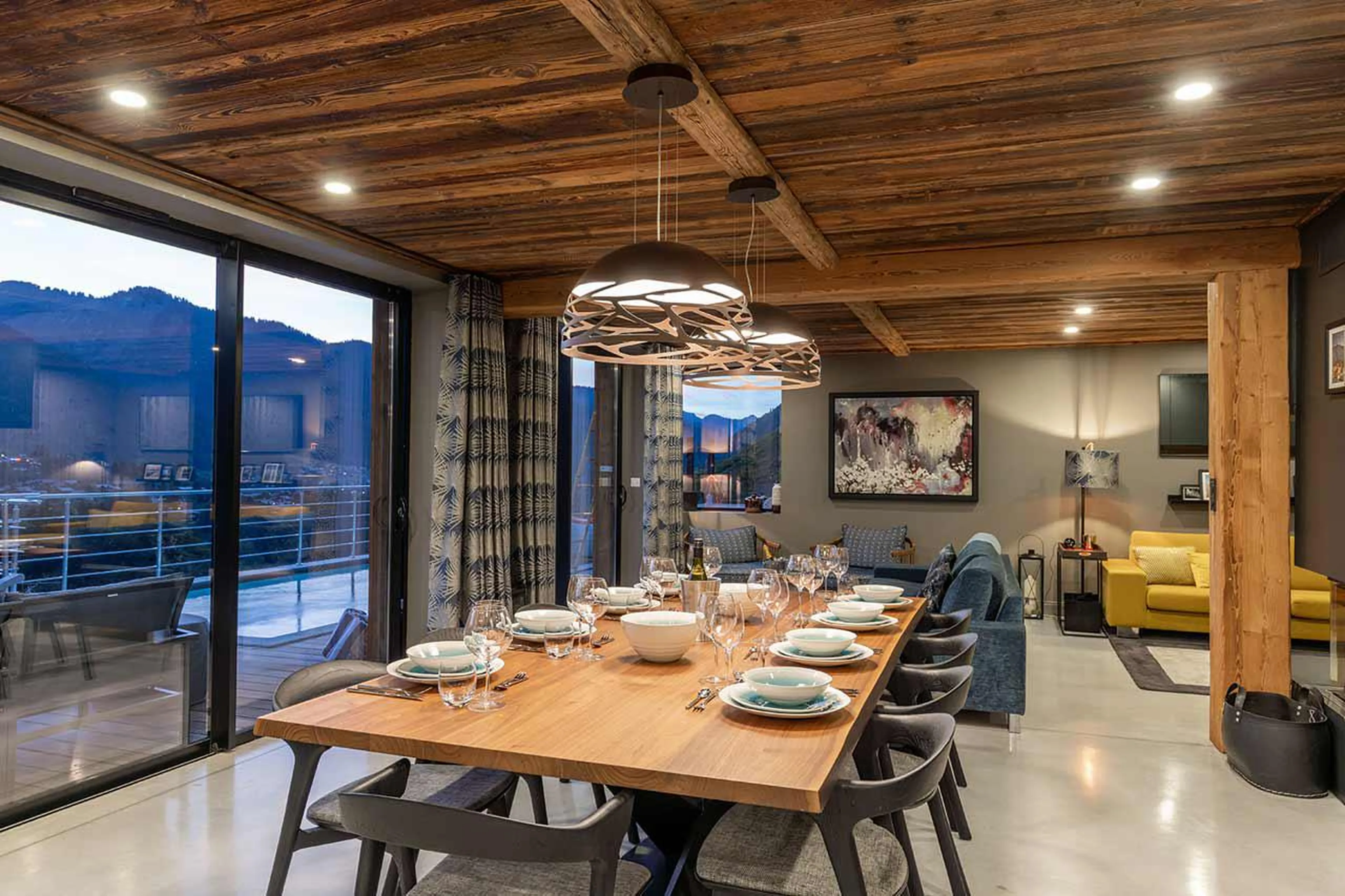 Floor-to-ceiling windows from dining area at Alpine Retreat in Morzine