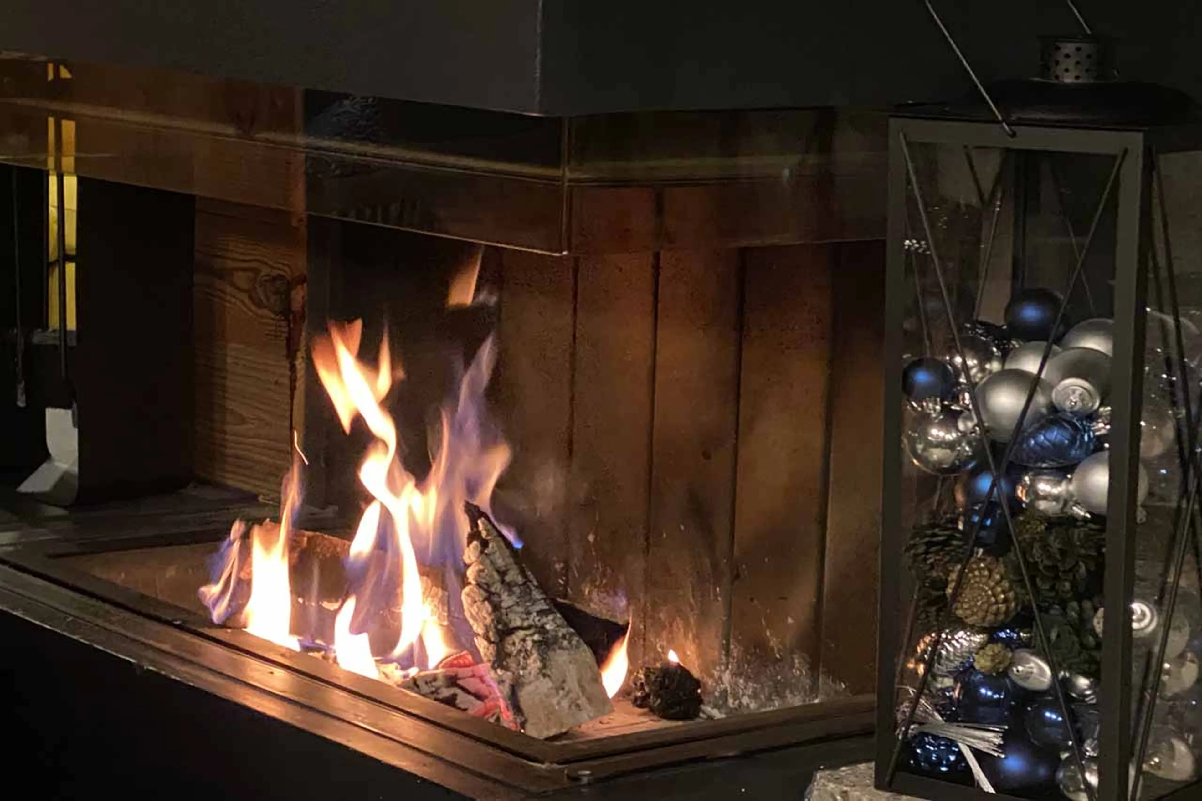 Glass-fronted fireplace at Alpine Retreat in Morzine