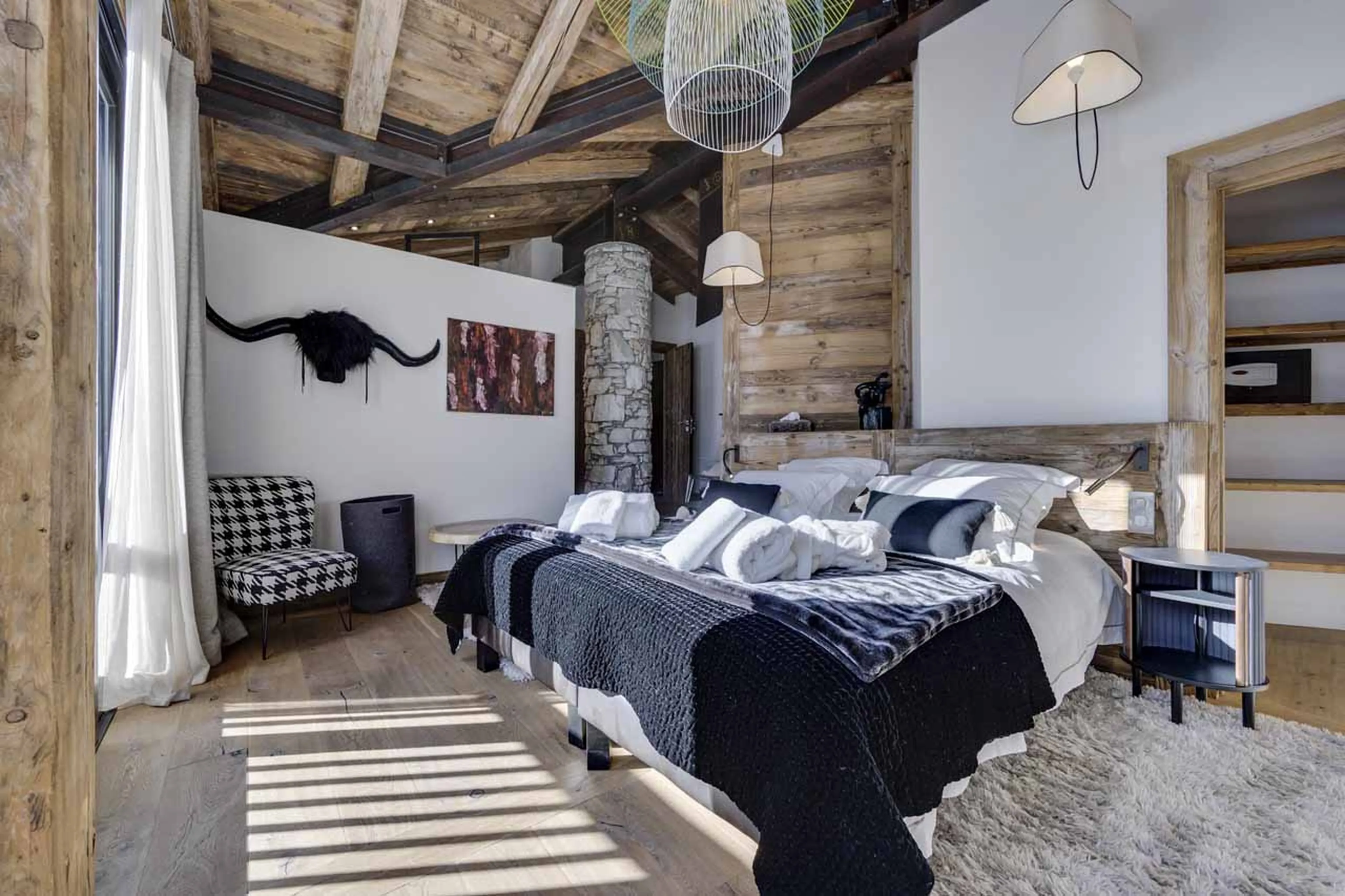 Master bedroom bed at Chalet Artemis in Val d'Isere
