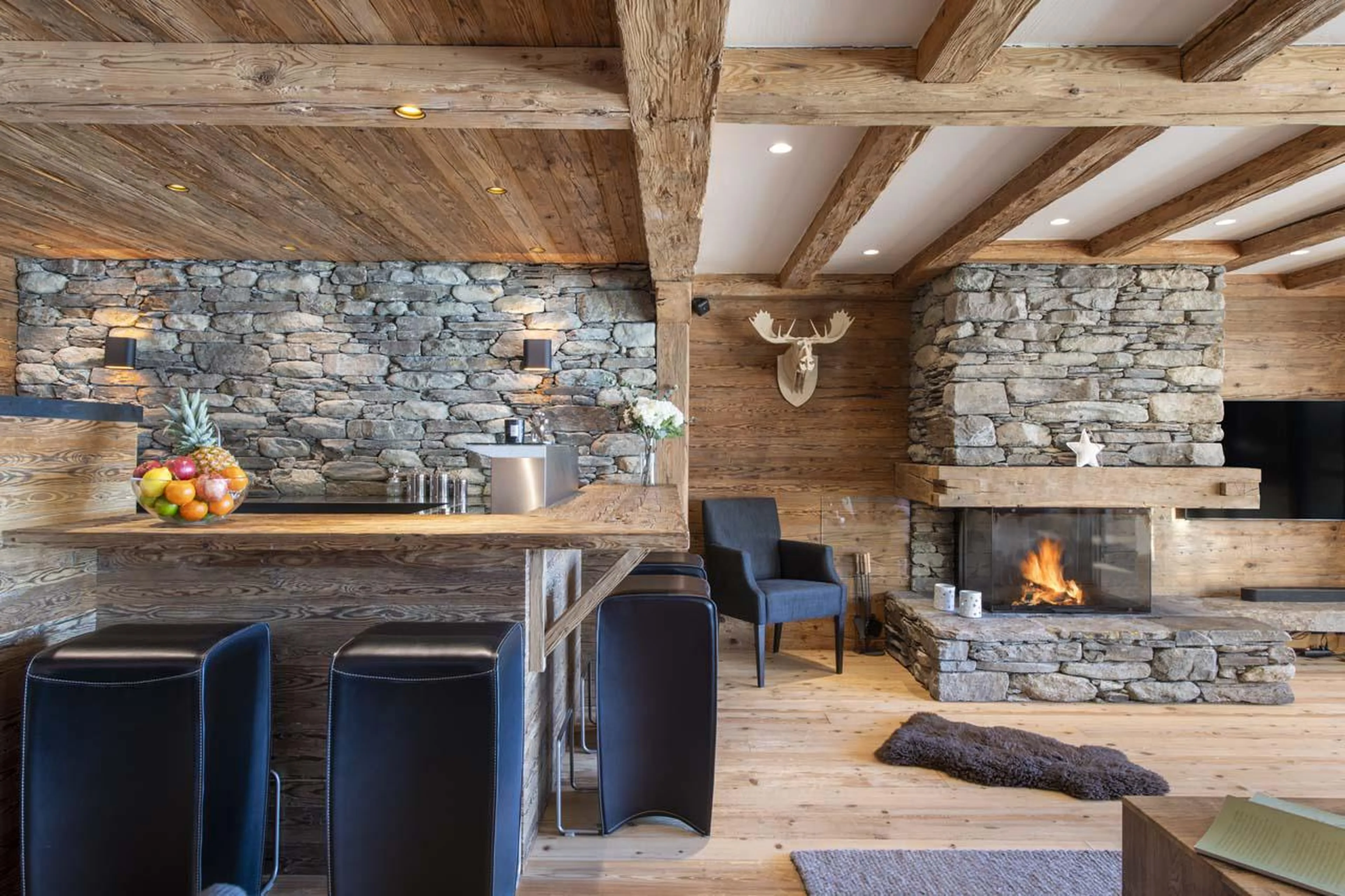 Living area with traditional chalet feel at Apartment Basalte C13 in Verbier