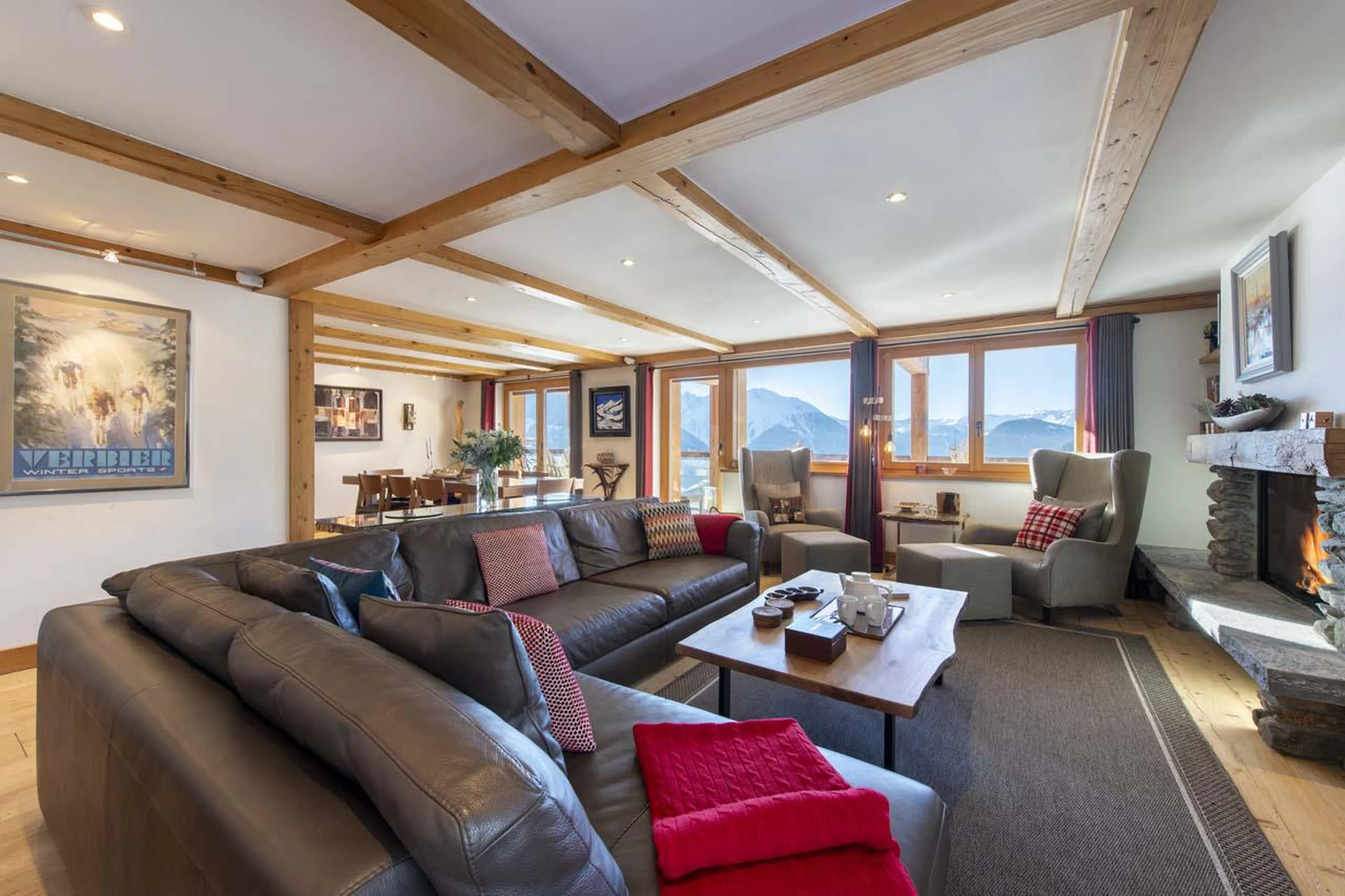 The sofa area lies adjacent to the dining space at Apartment Basalte in Verbier