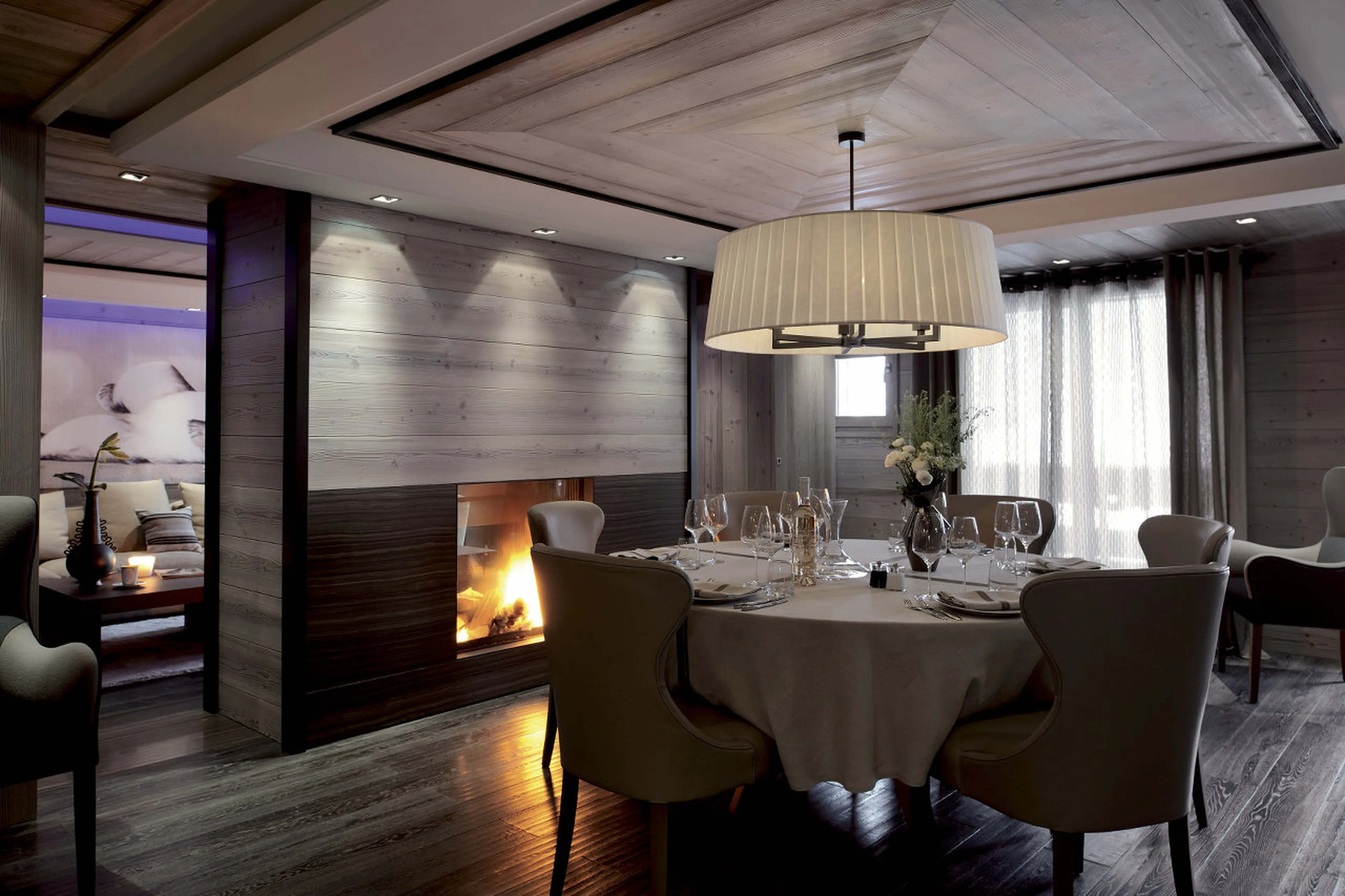 Central fireplace warming dining area of Apartment Beryl in Courchevel 1850