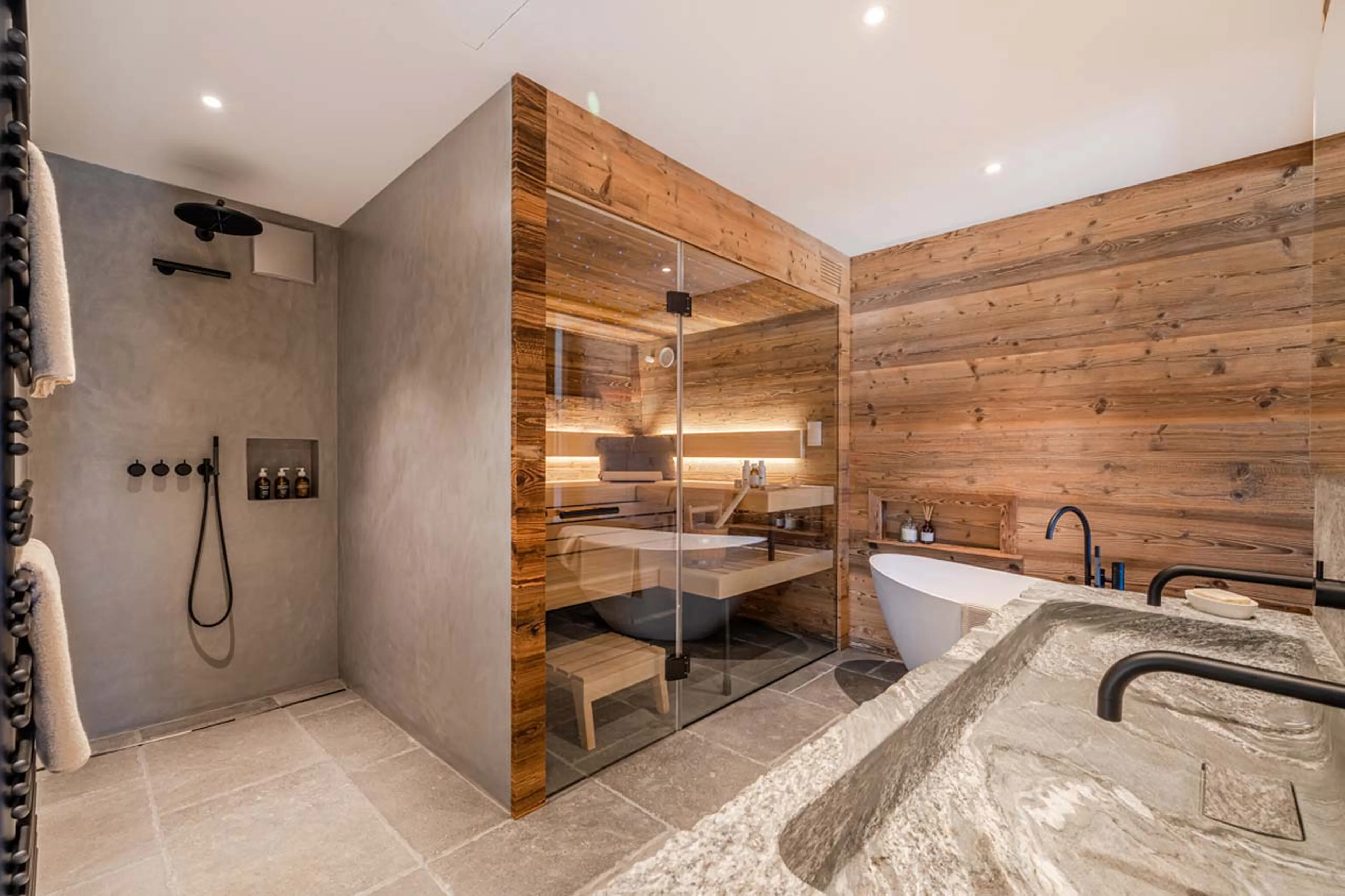 Shower & sauna in master bathroom at Apartment Mountain Dream in Davos