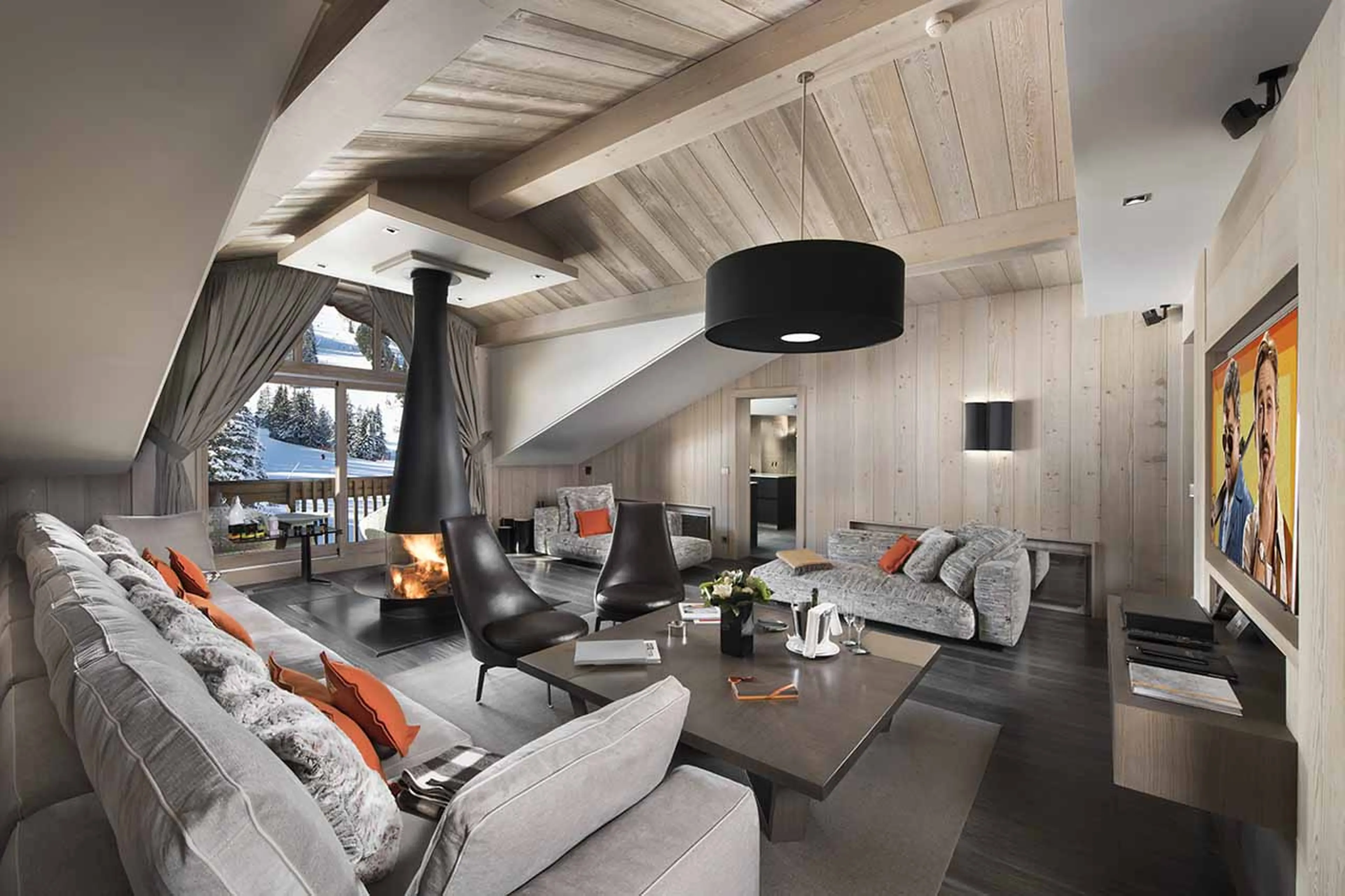 Living room with inviting couches and fireplace in Apartment Emerald in Courchevel 1850