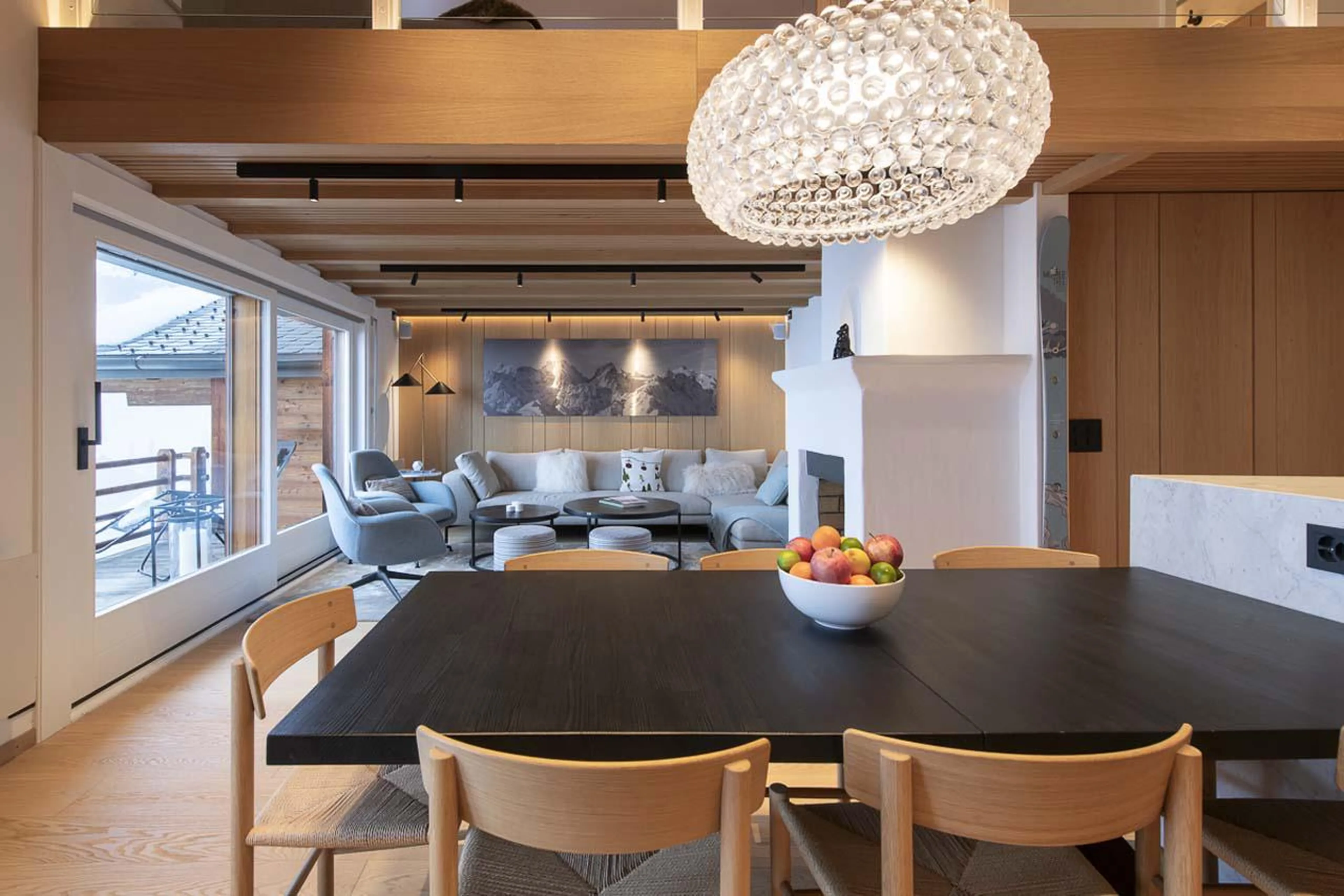 Living area with access to south-facing balcony at Apartment Grignote in Verbier