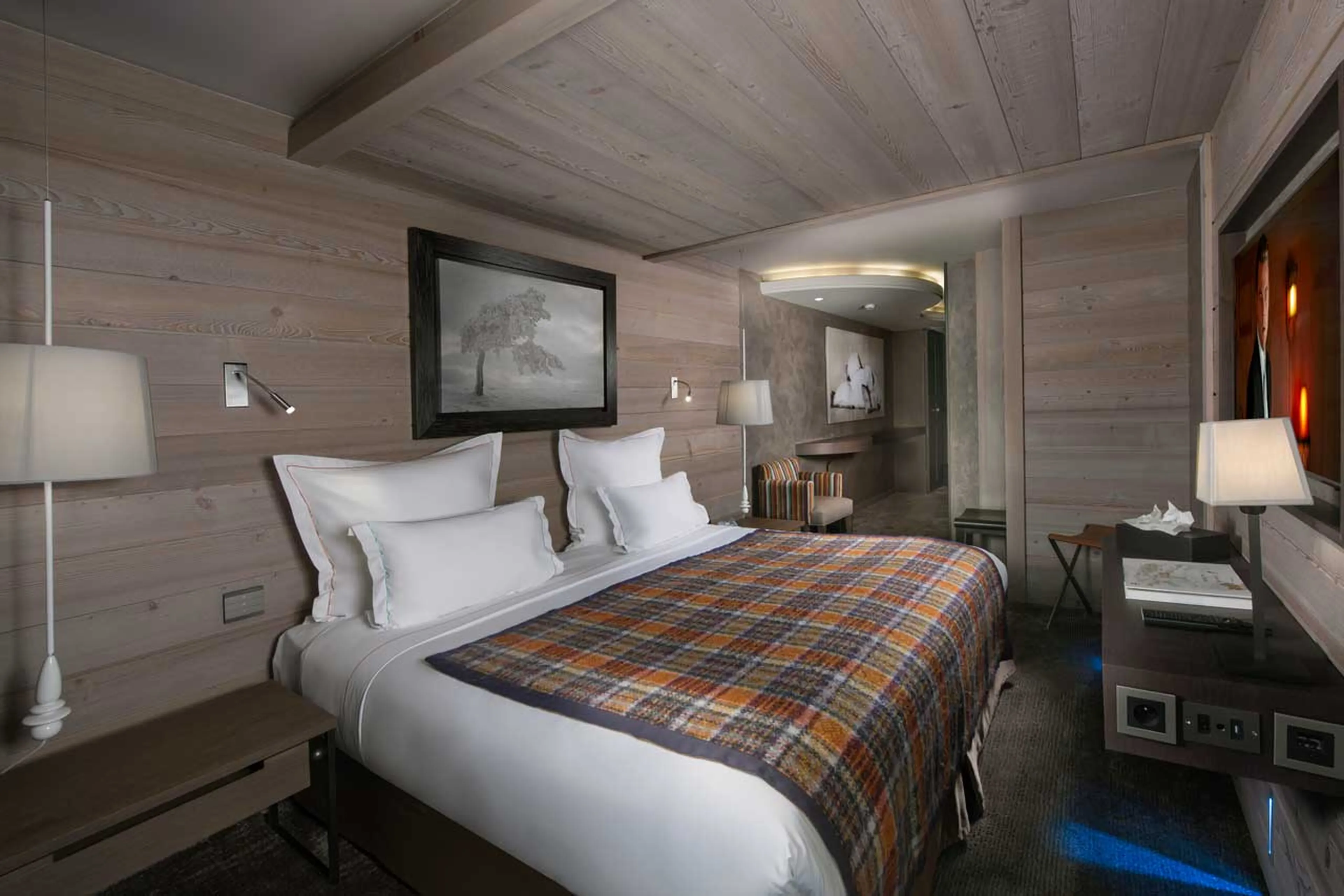 Bedroom with double bed and balcony access in Apartment Jade in Courchevel 1850
