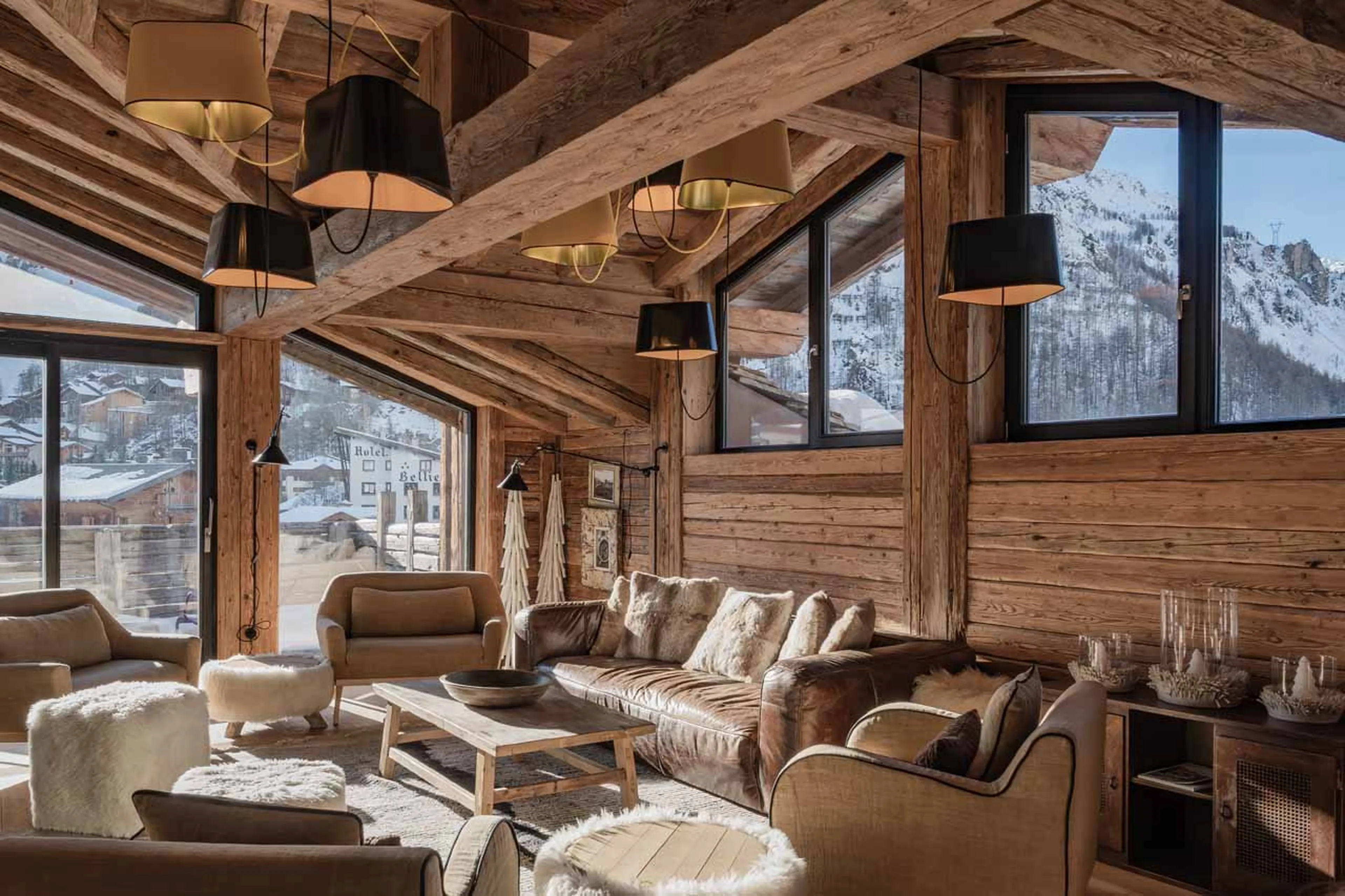 Comfortable sofas and balcony access in Le Penthouse Savoie, Val d'Isere