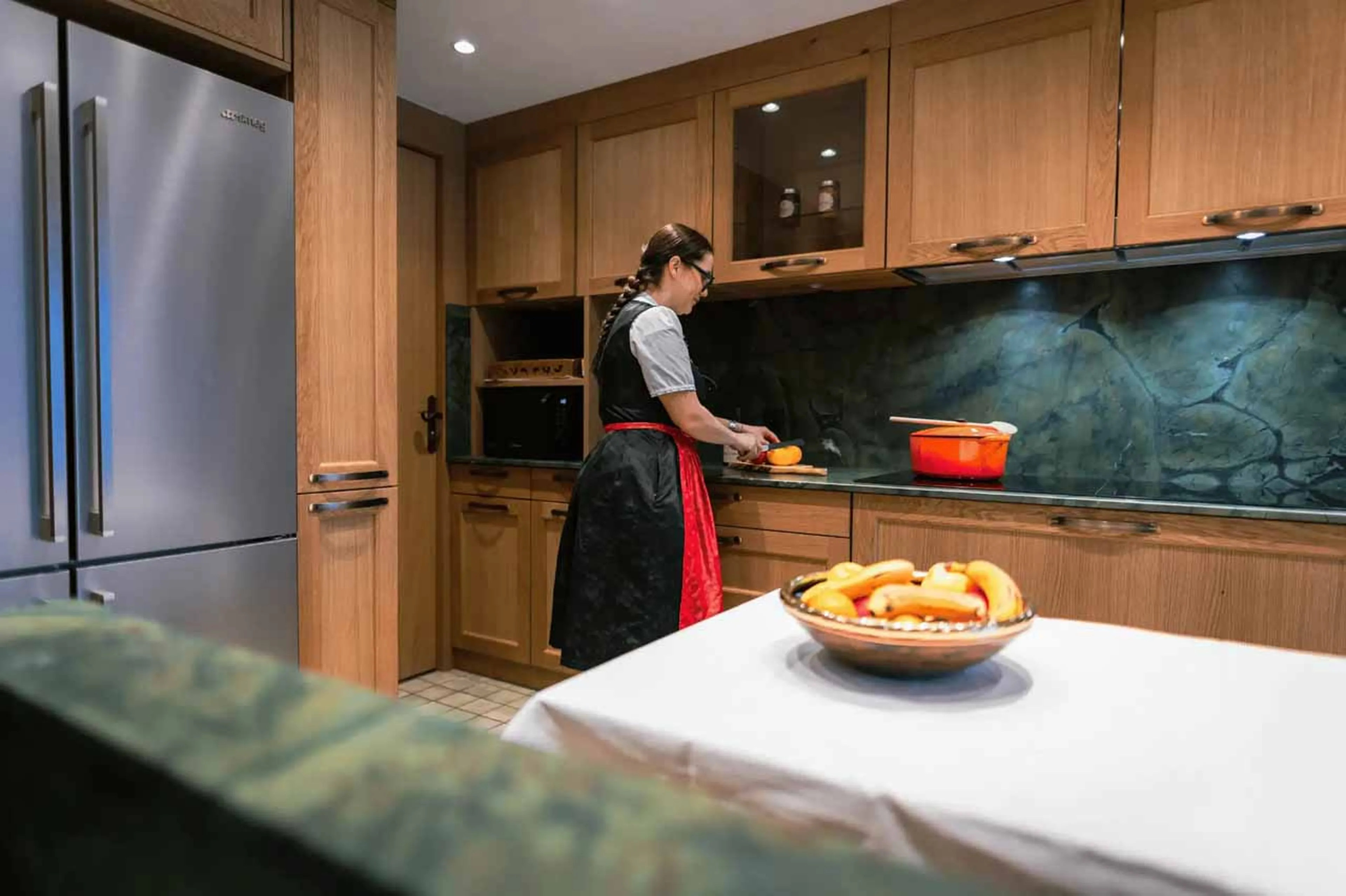 Fully equipped kitchen with breakfast area and balcony access in Apartment Le Refuge, Courchevel 185