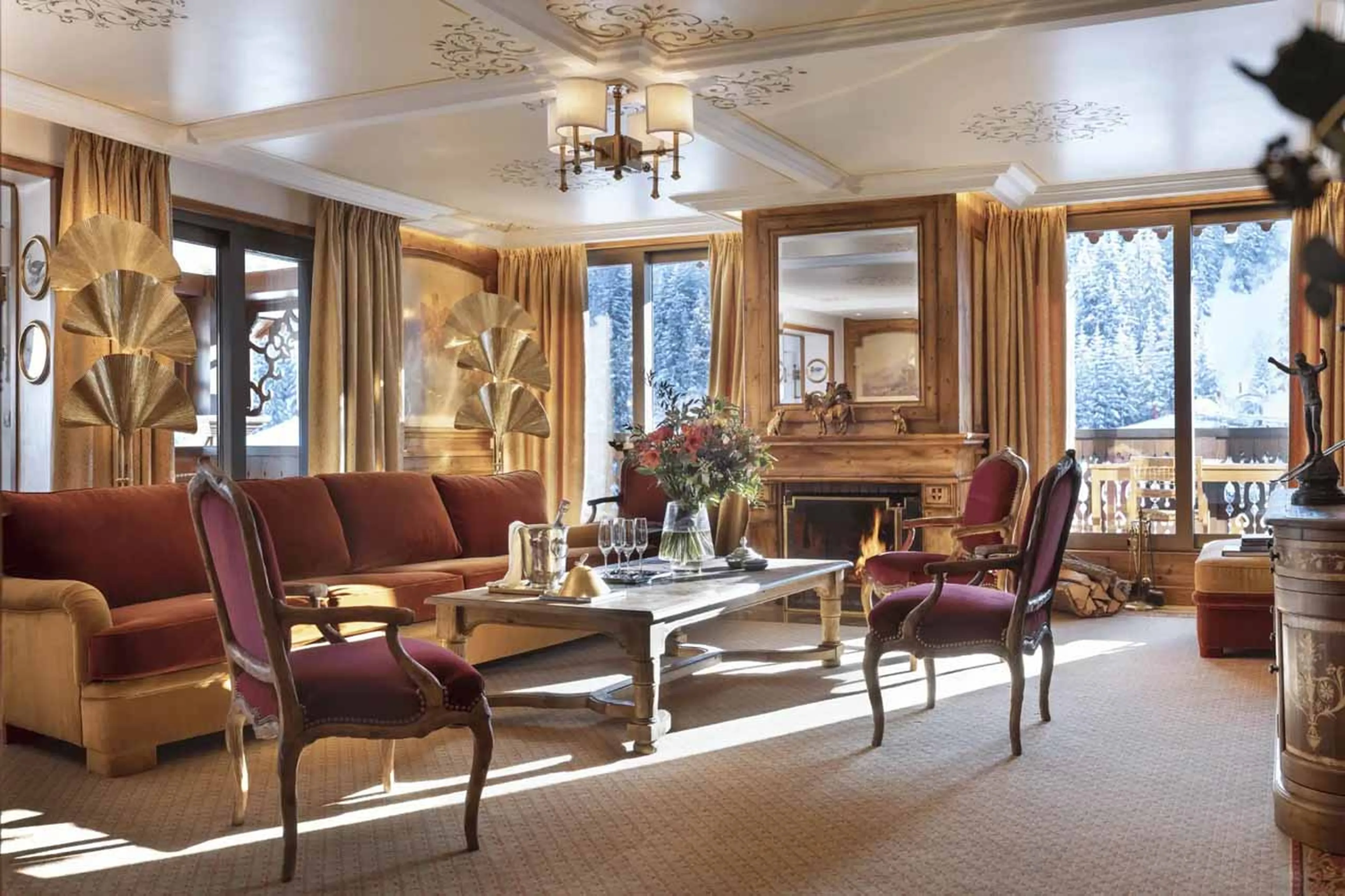 Graceful living room with fireplace and balcony access in Apartment Le Refuge, Courchevel 1850