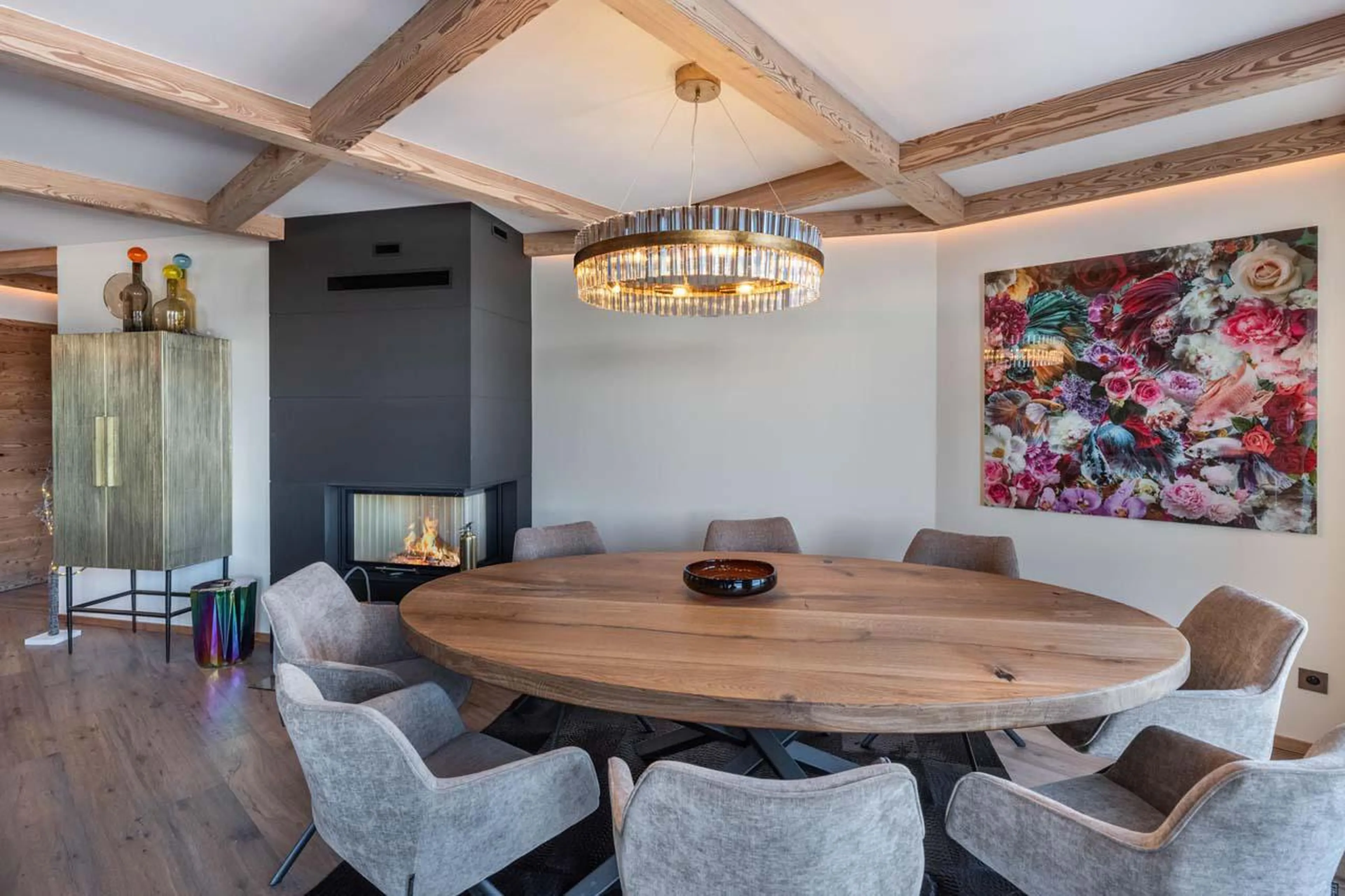 Dining table and fireplace at Apartment Limeo in Courchevel 1850