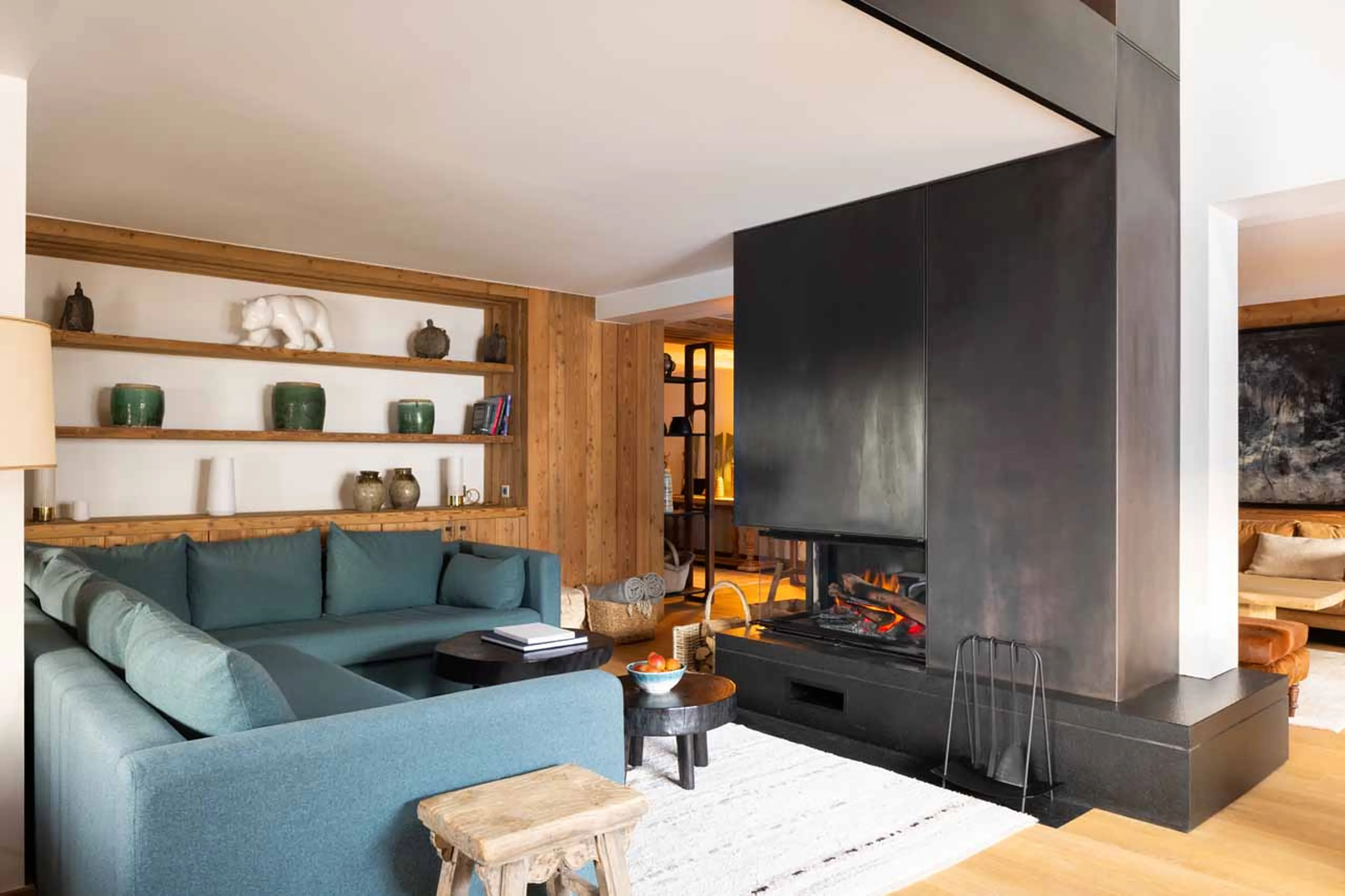 Sofa and fireplace at Apartment Nanuq in Meribel