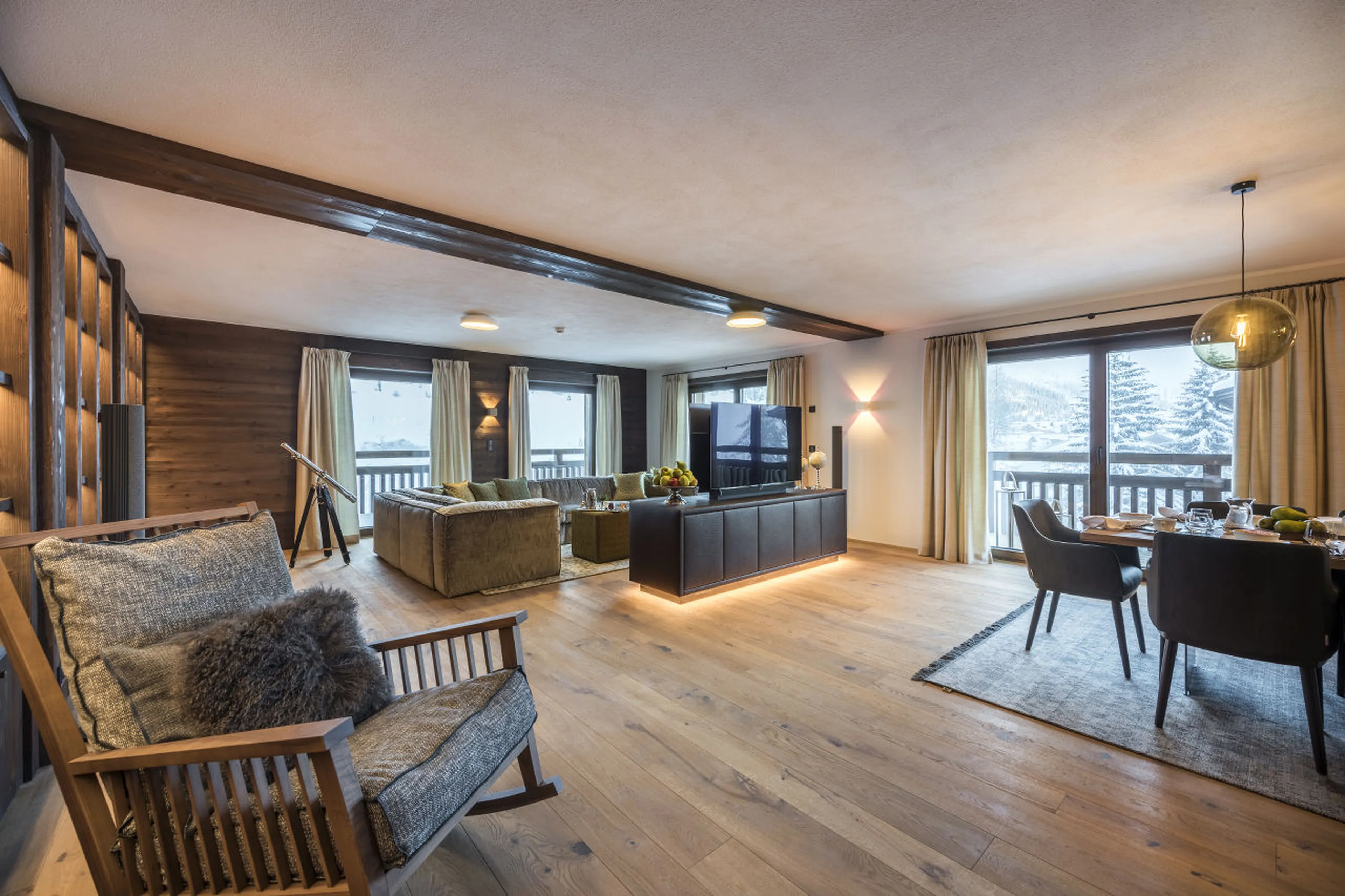 Living area with access to south-facing terrace in Nidus Apartment 3 in Lech