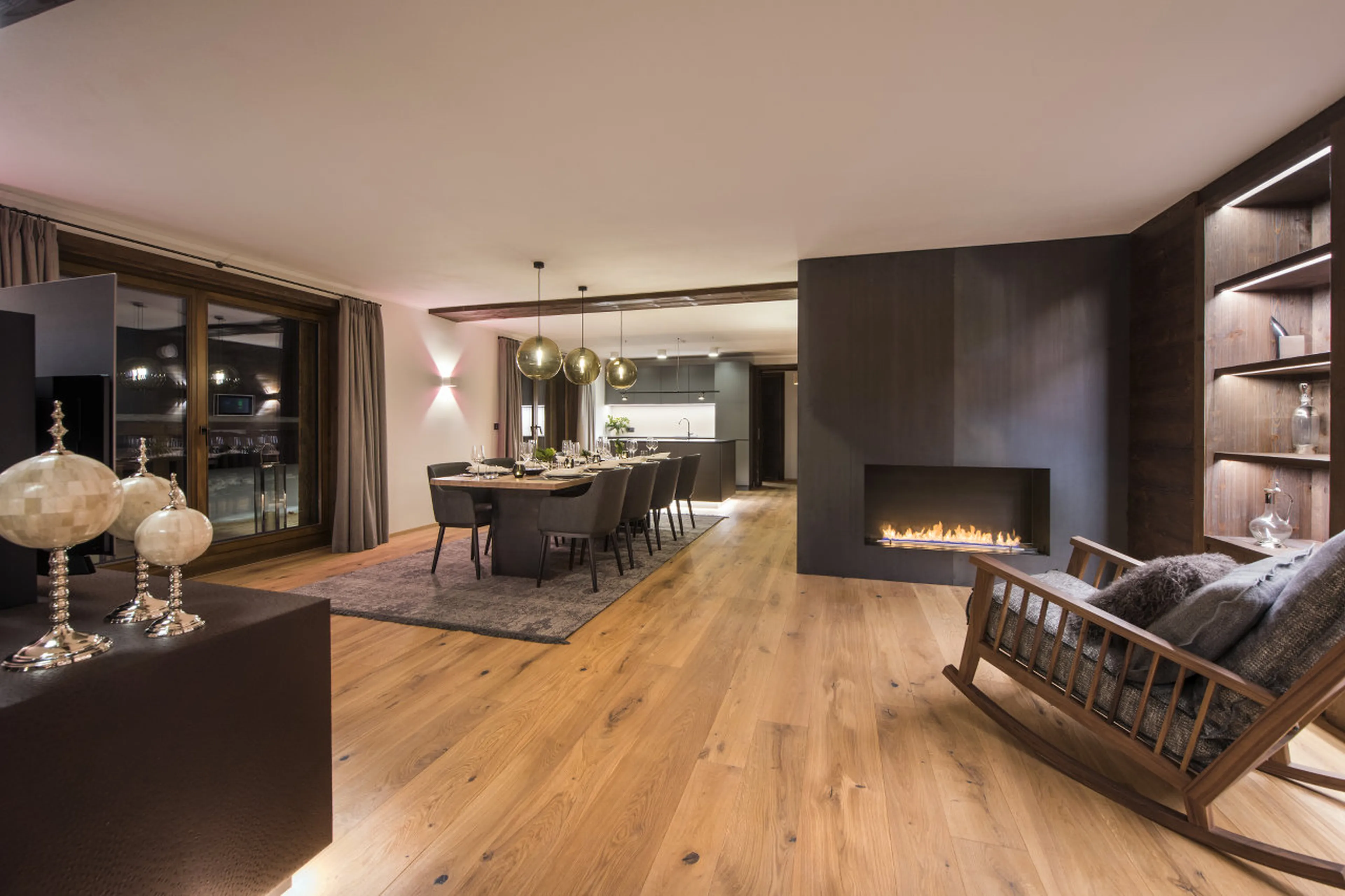 Fireplace forms important part of living and dining area in Nidus Apartment 4 in Lech