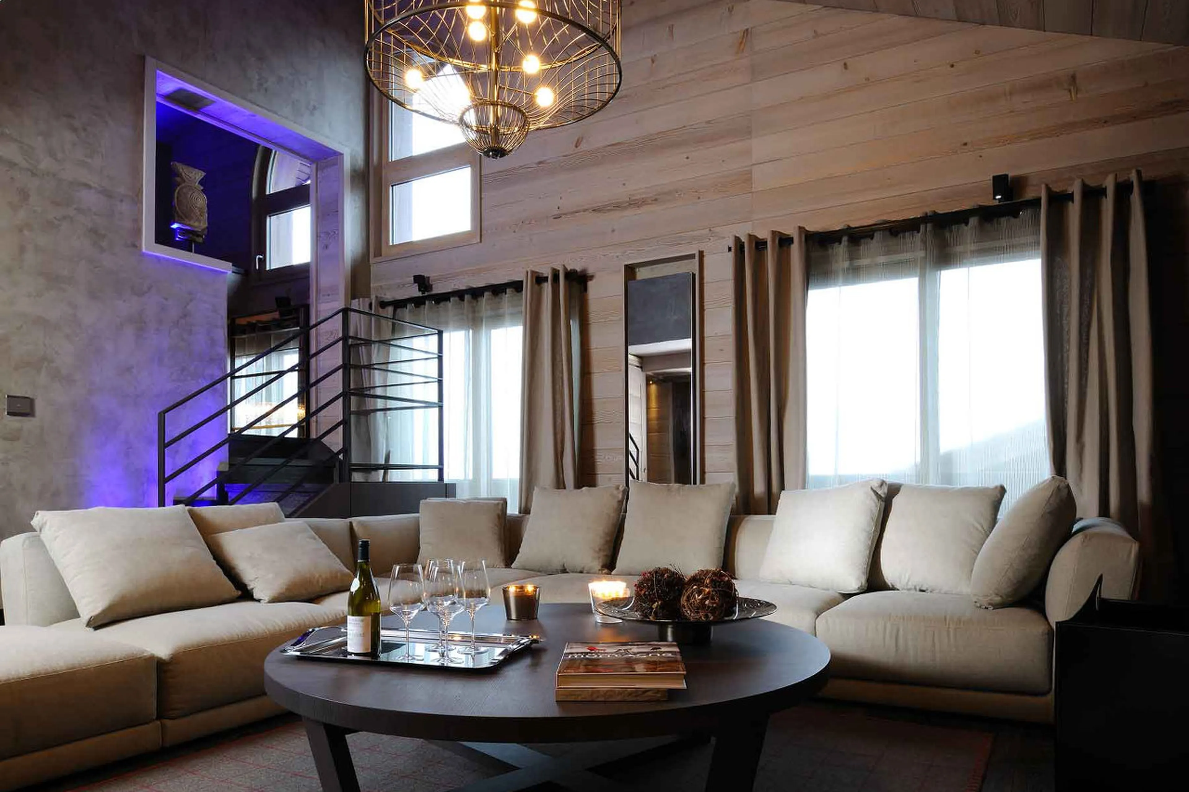 Living room with double height ceiling in Apartment Ruby in Courchevel 1850
