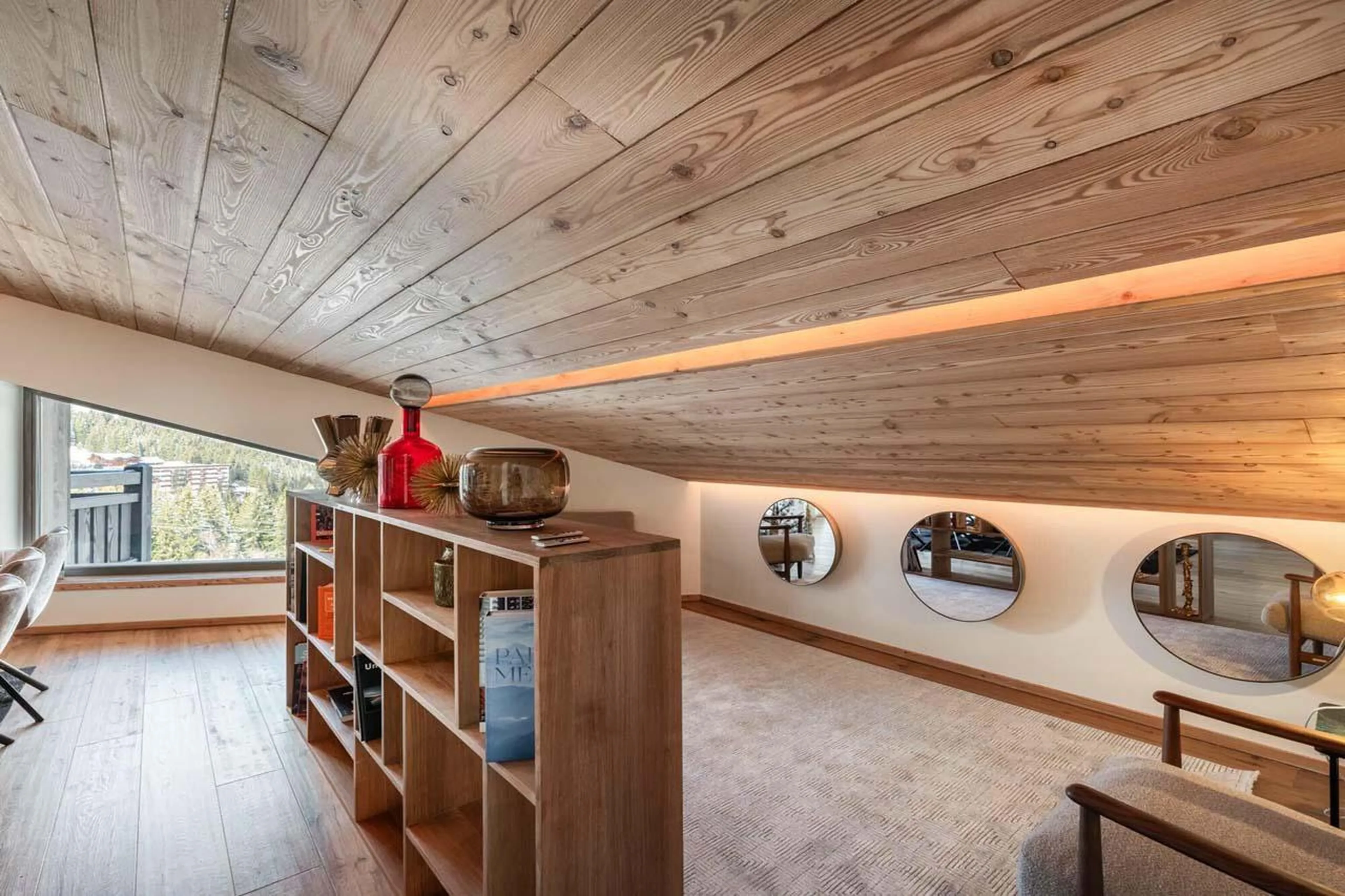 Living area with alpine materials and neutral colours at Apartment Sirio in Courchevel 1850