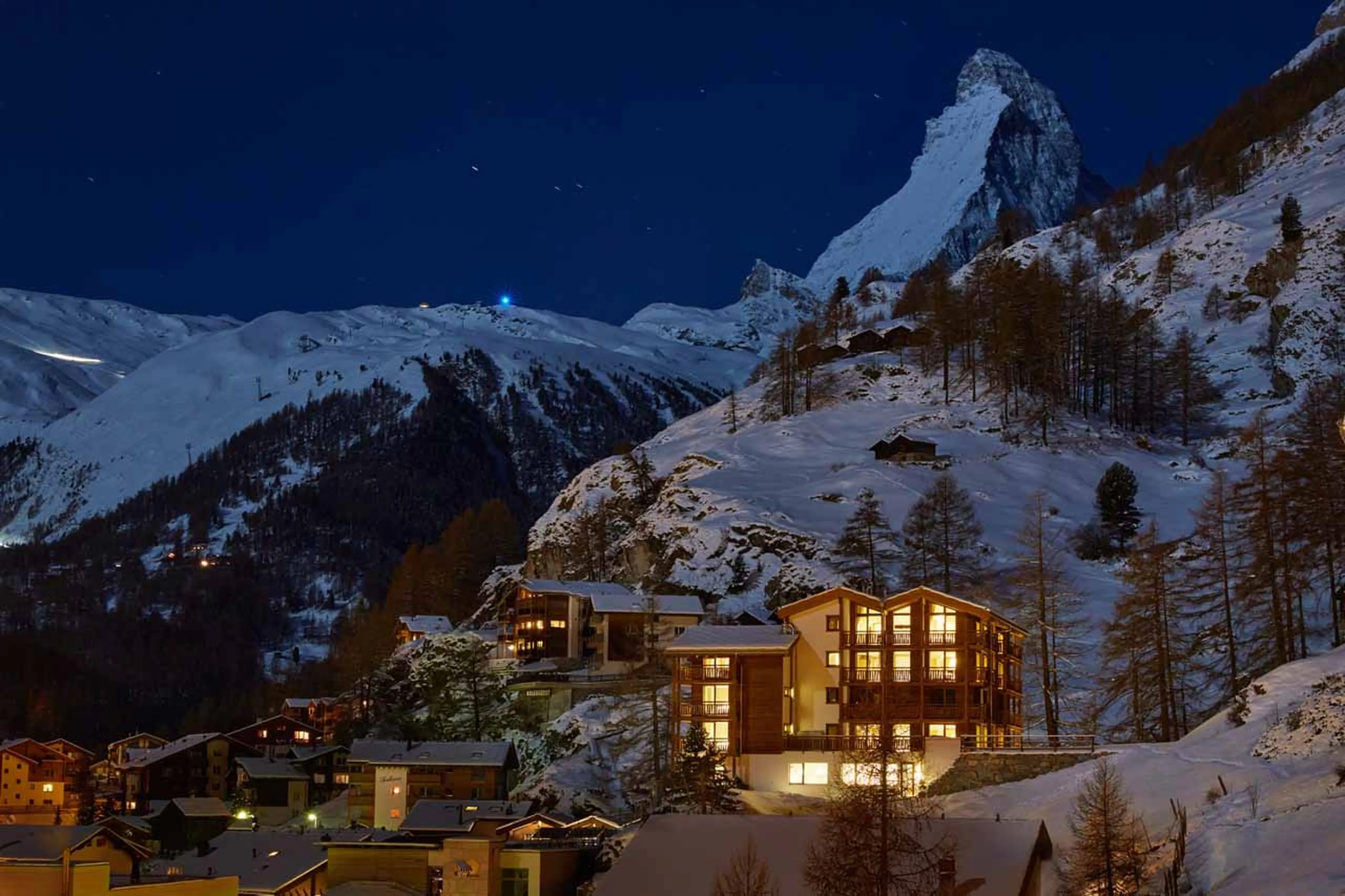 Exterior of La Vue Residence at night in Zermatt