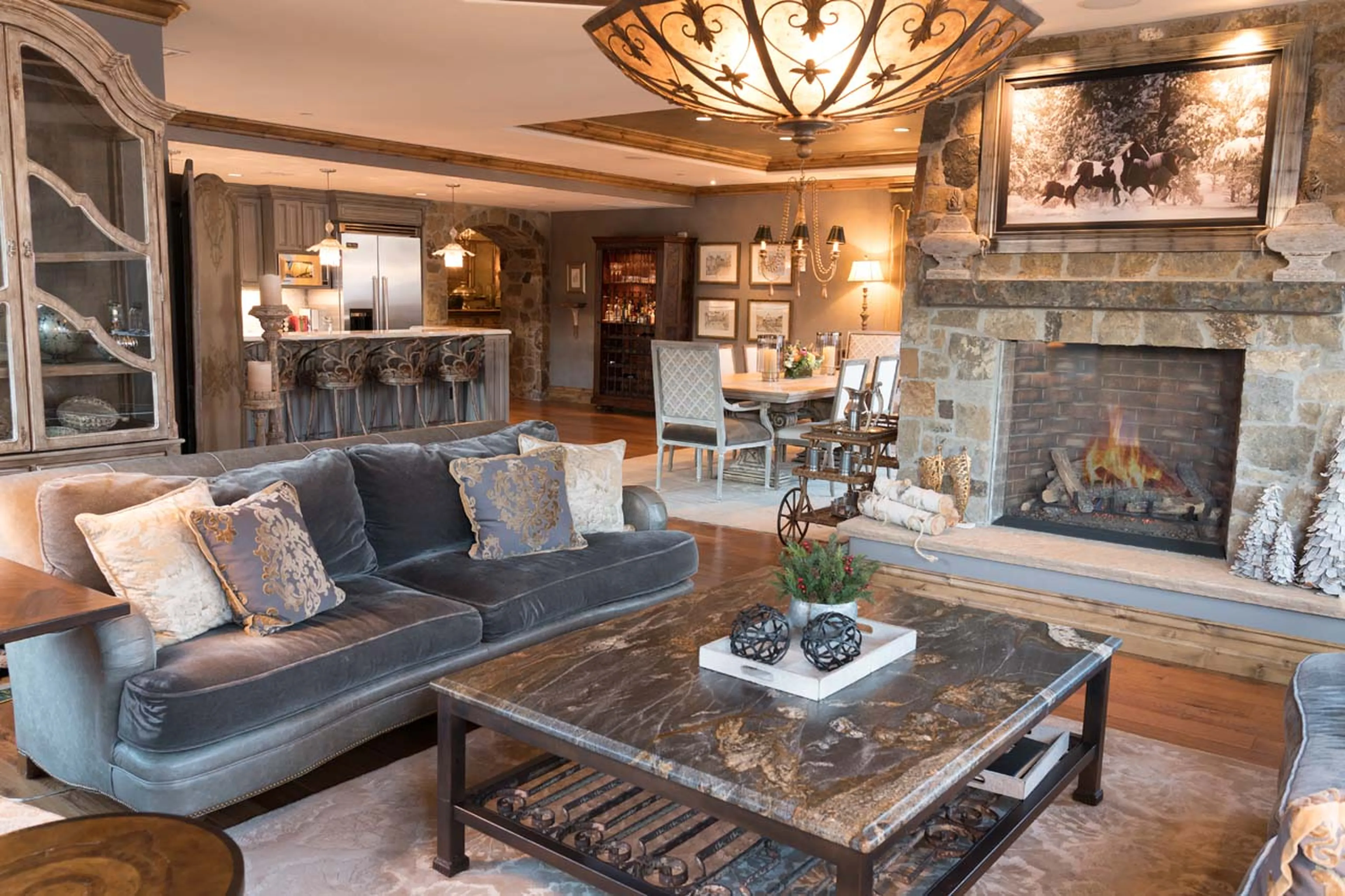 Stone fireplace in living room of Arrabelle Chalet in Vail