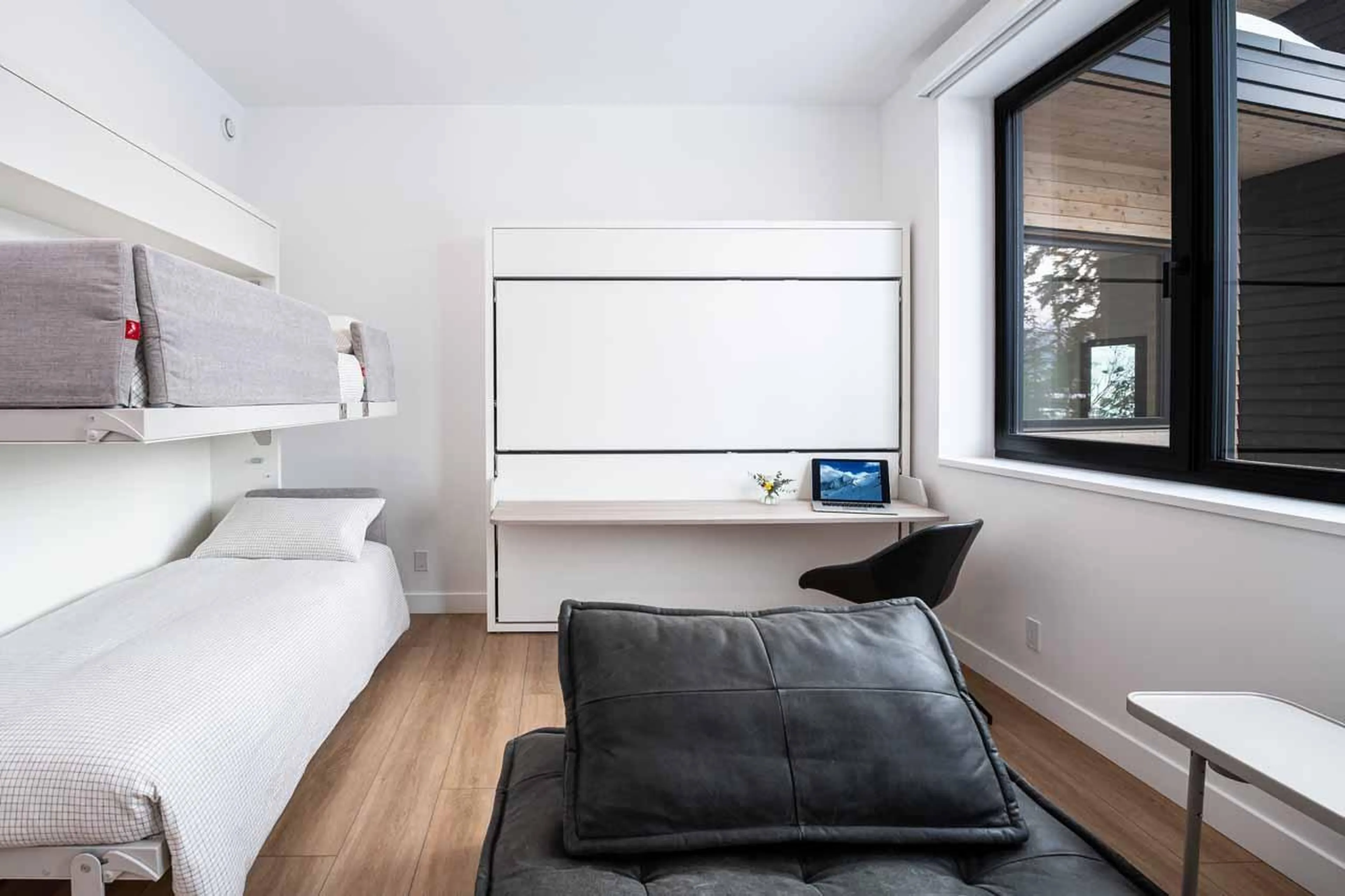 Bedroom with European fold-out bunkbeds at Arrowhead Lodge in Revelstoke