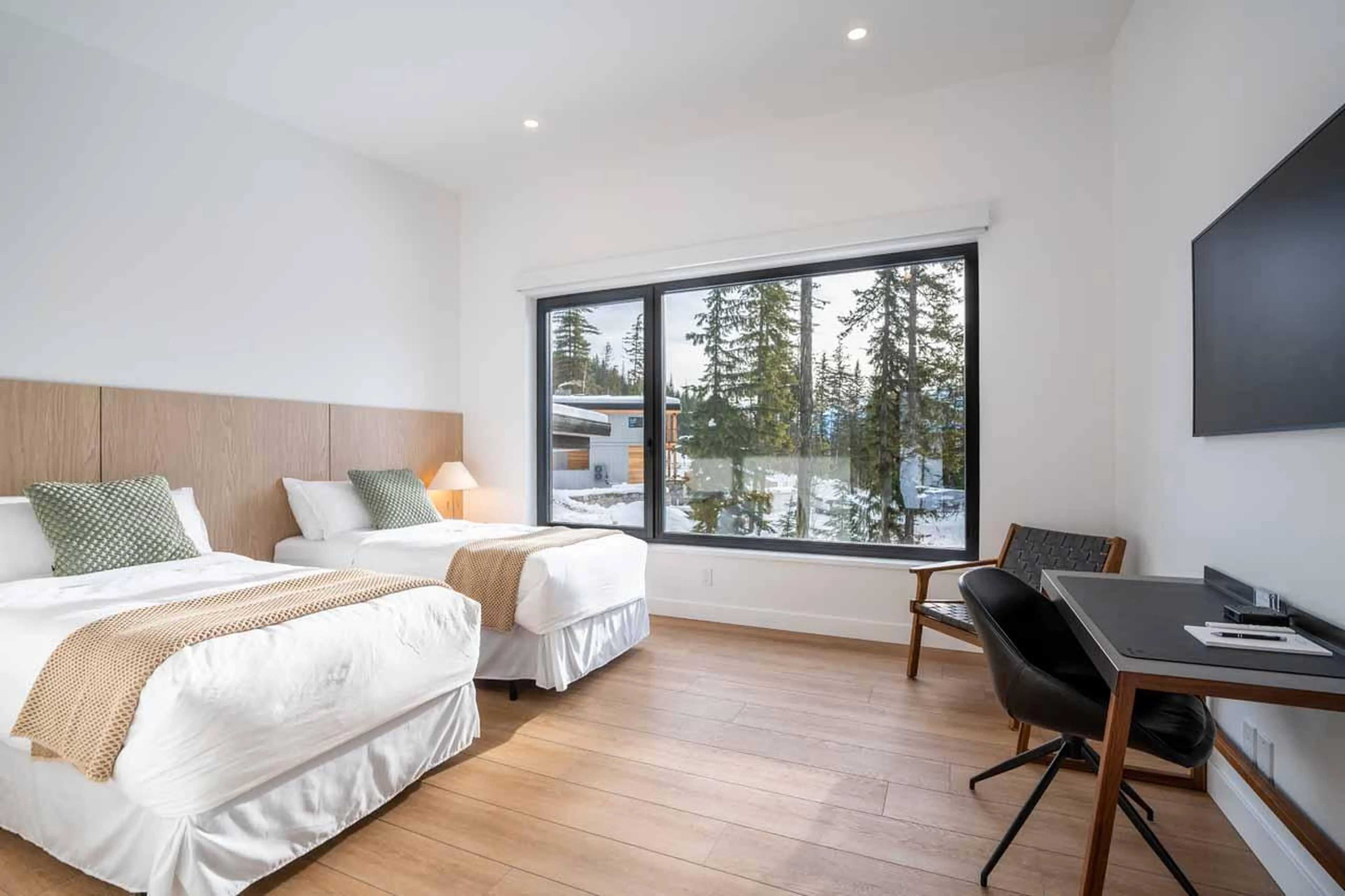 King/twin bedroom photographed with twin setup at Arrowhead Lodge in Revelstoke